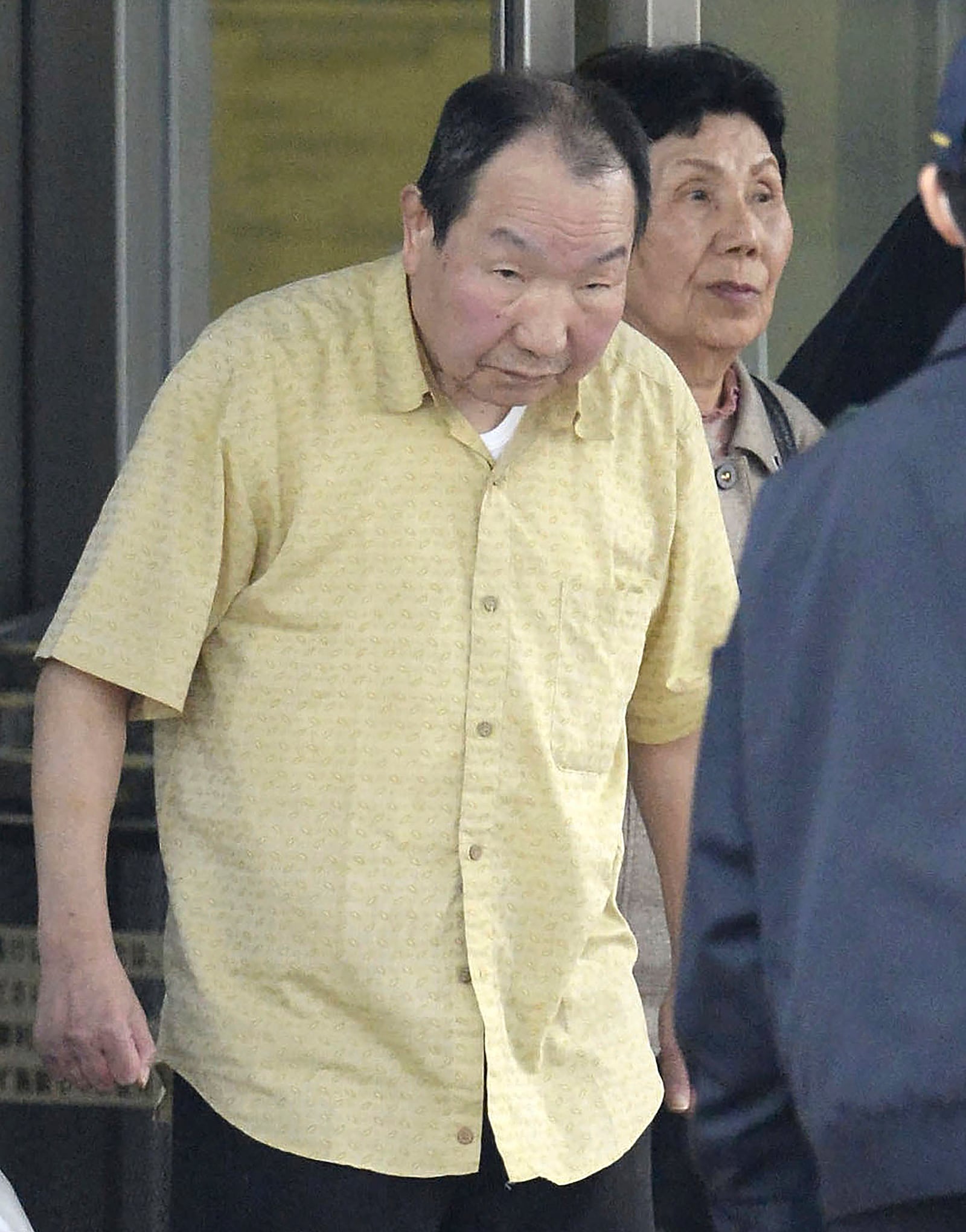 Iwao Hakamada, left, who has been sentenced to death in a 1966 quadruple murder case, leaves a detention center in Tokyo with his sister Hideko Hakamada, on March 27, 2014 after the Shizuoka District Court ordered a retrial. Japanese prosecutors said on Oct. 8, 2024 they will not appeal the Sept. 26 ruling of the Shizuoka District Court that acquitted the world’s longest-serving death-row inmate in a retrial. (Kyodo News via AP)