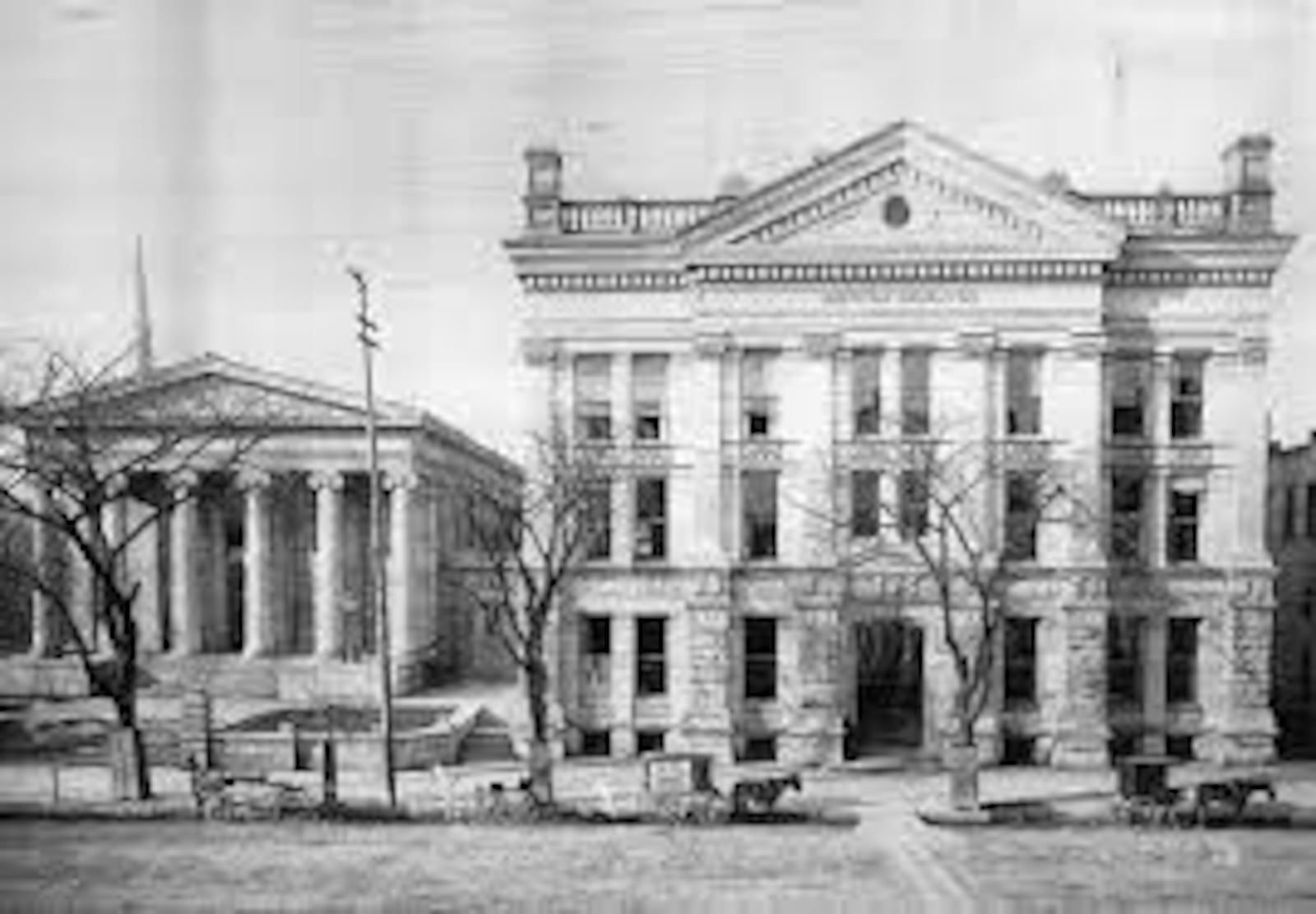 The Old Montgomery County Courthouse, left, with the 'new Montgomery County Courthouse beside it.