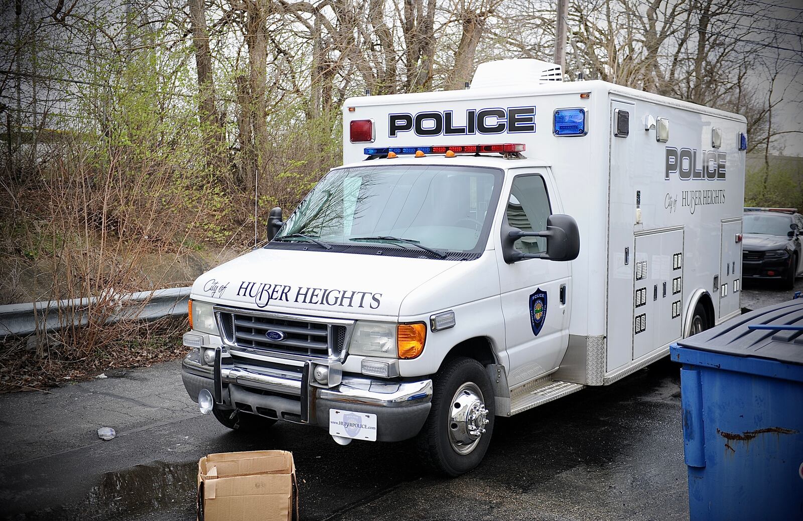 Police investigate after a body was found behind businesses and a school Monday, April 11, 2022, off Chambersburg Road in Huber Heights. MARSHALL GORBY \ STAFF