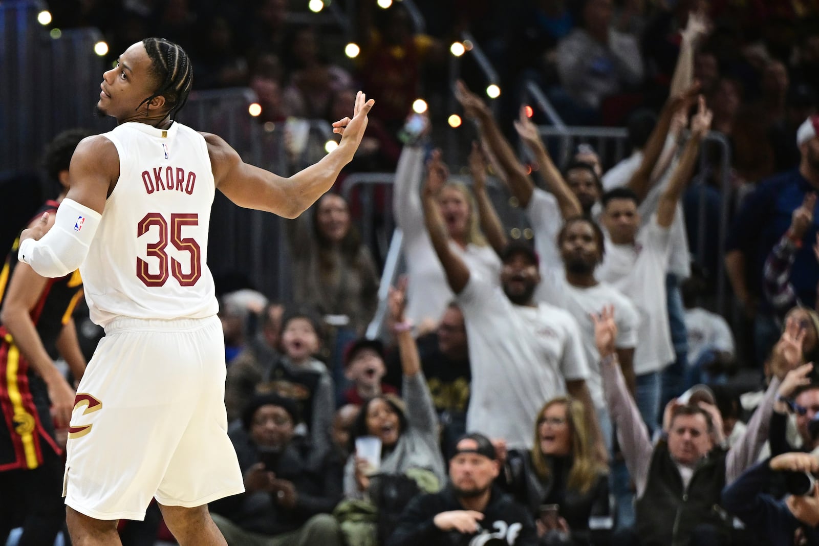 Cleveland Cavaliers forward Isaac Okoro reacts after a three point basket in the first half of an NBA basketball game against the Atlanta Hawks, Wednesday, Nov. 27, 2024, in Cleveland. (AP Photo/David Dermer)