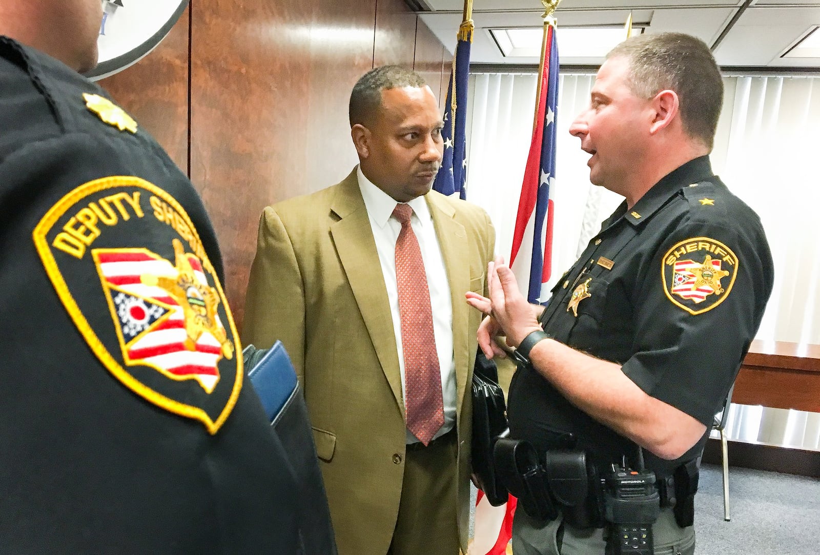 Montgomery County Administrator Michael Colbert and Montgomery County Sheriff Rob Streck speak after a meeting in which county commissioners approved moving forward with a jail expansion study phase. CHRIS STEWART / STAFF