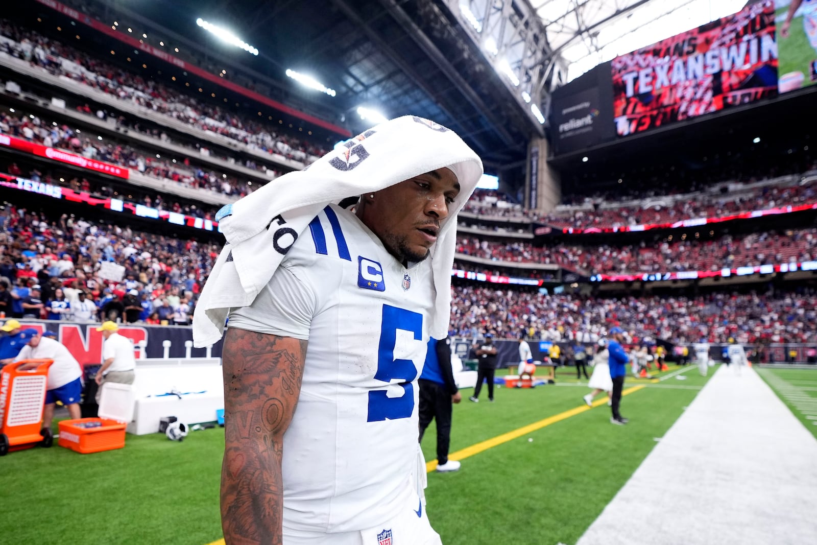 Indianapolis Colts quarterback Anthony Richardson (5) walks off the field after an NFL football game against the Houston Texans, Sunday, Oct. 27, 2024, in Houston. The Texans won 23-20. (AP Photo/Tony Gutierrez)