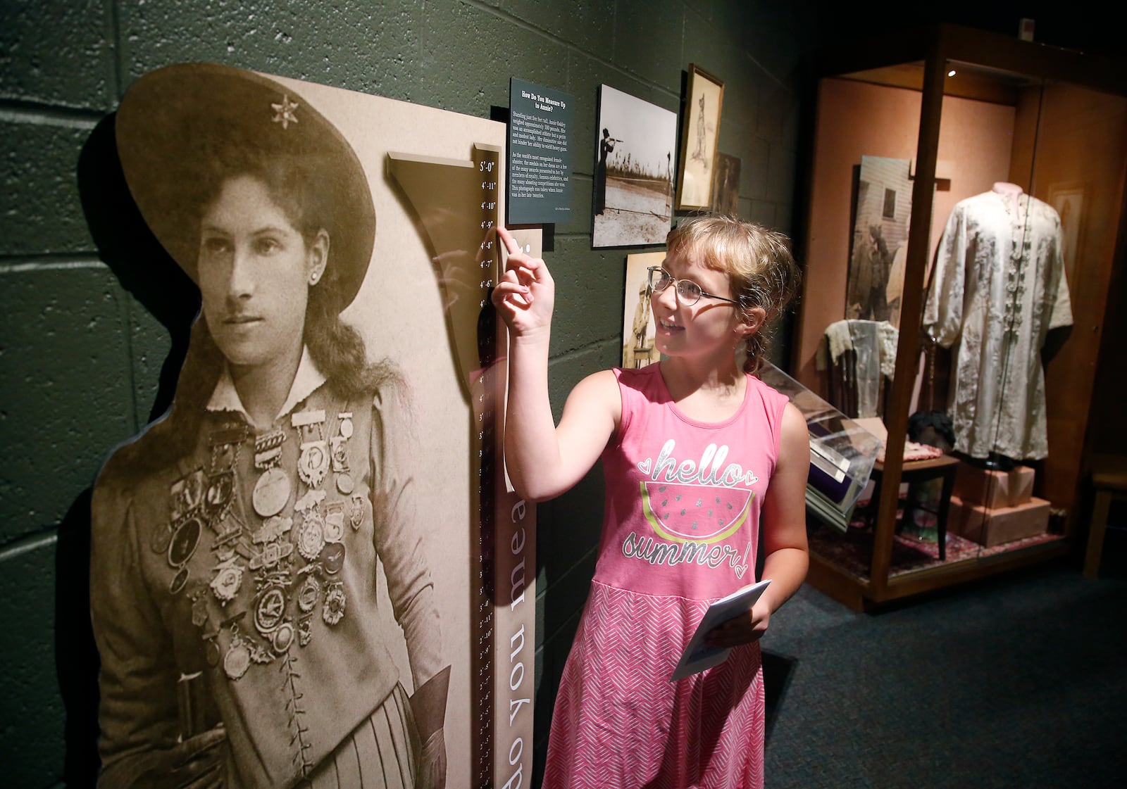 “I think she’s a role model for lots of people because back then women would just cook and clean while the men did all the shooting,â said 11-year-old Alexis Stump of Union City, Ind. as she compared her own height to a life-sized cutout of Oakley at The Annie Oakley Center in Greenville. LISA POWELL / STAFF