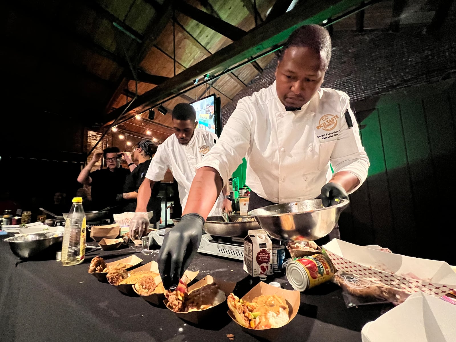 The final round of the Diced in Dayton Chef's Challenge saw the team from Rich Taste Catering led by chef and owner Gerald Richardson (far right) face off against the team from Corner Kitchen led by executive chef Gavin St. Denis (far left). PHOTO BY ALEXIS LARSEN