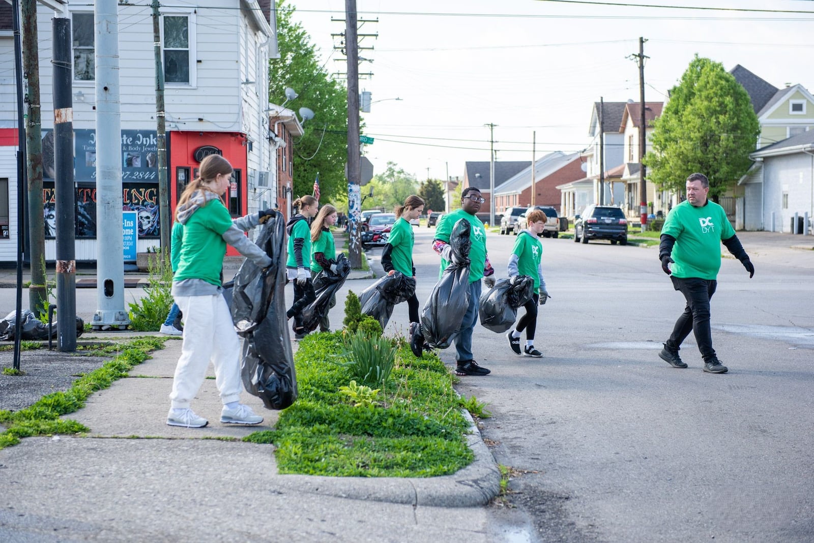 Volunteers from Dayton Dream Center help with the Living City Project citywide cleanup in 2023. PHOTO/JUSTIN SPIVEY