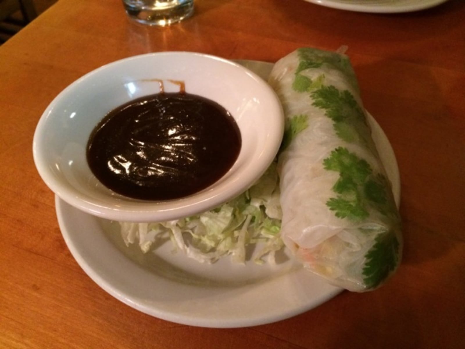 Soft vegetable roll: carrots, zucchini, squash, cilantro and vermicelli rice noodles rolled in a spring roll wrapper and served with hoisin and sweet chili dipping sauce at Christopher's Restaurant. RASHIDA RAWLS / STAFF 