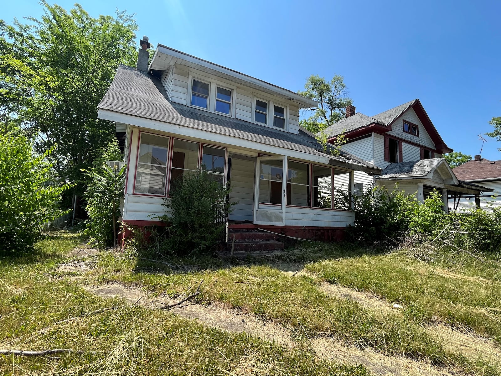 A vacant home in West Dayton that owes delinquent taxes. CORNELIUS FROLIK / STAFF