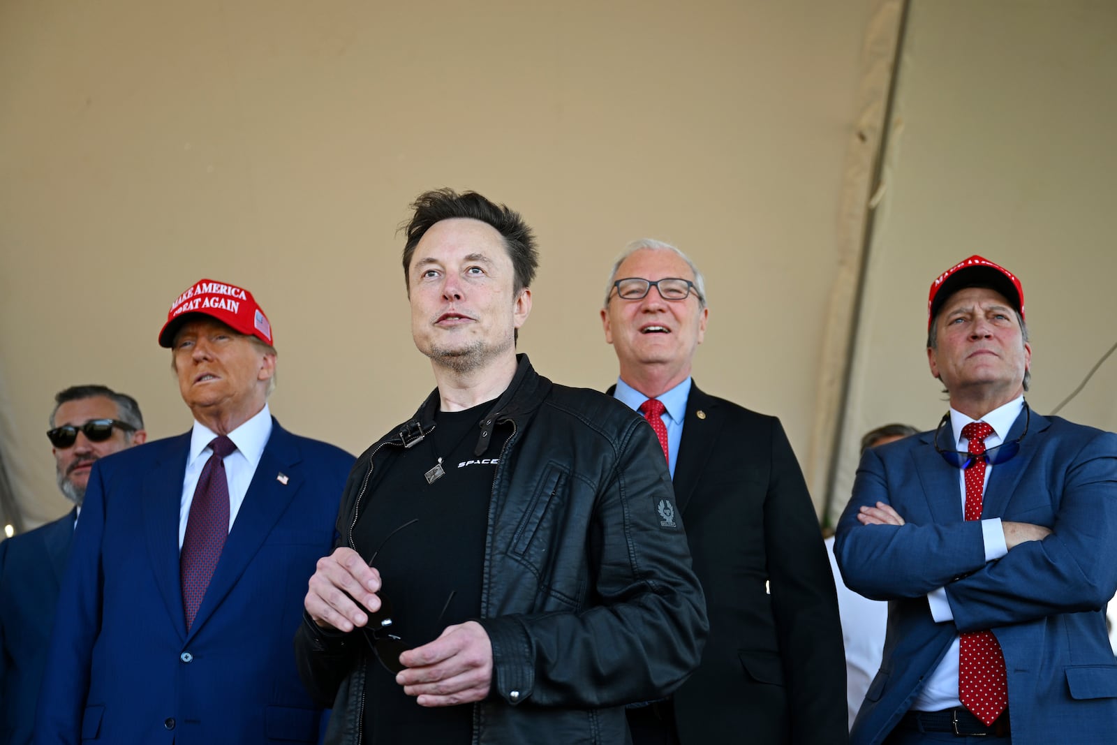 President-elect Donald Trump watches with Elon Musk as Sen. Bill Hagerty, R-Tenn., left, and Sen. Ted Cruz, R-Texas, left, Sen. Kevin Cramer, R-N.D., and Rep. Ronny Jackson, R-Texas, before the launch of the sixth test flight of the SpaceX Starship rocket Tuesday, Nov. 19, 2024 in Brownsville, Texas. (Brandon Bell/Pool via AP)