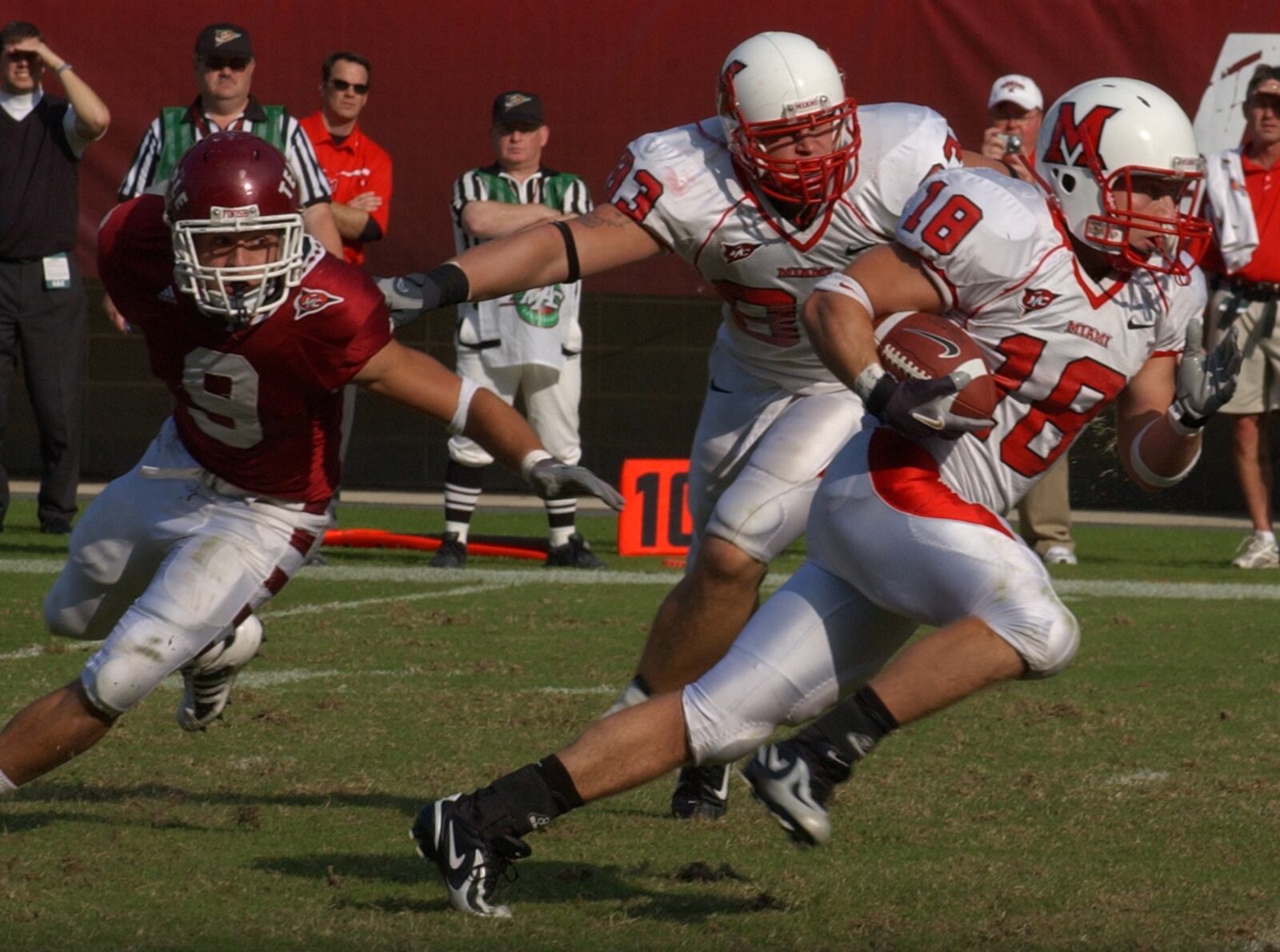 Redhawk WR Sean McVay, with the help of teammate Jake O'Connell, elude Temple's Anthony Ferla on Saturday, October 20, 2007. Contributed photo by Kevin Cook