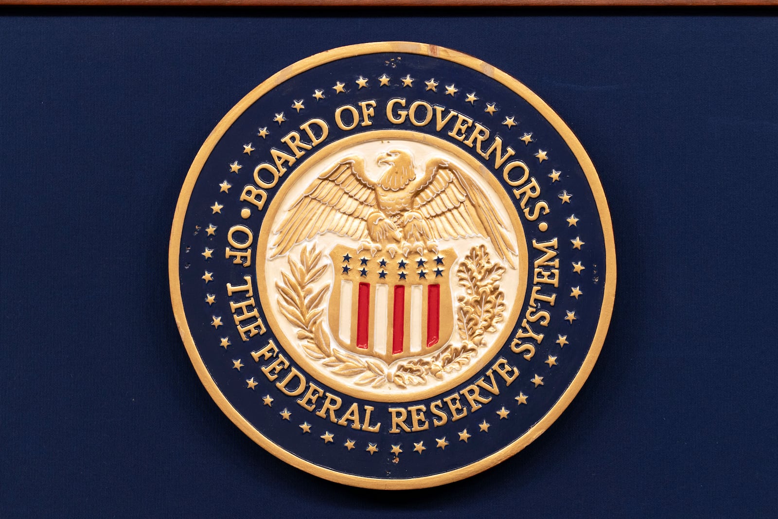 FILE - The seal of The Federal Reserve System is seen during a news conference by Federal Reserve Board Chairman Jerome Powell at the Federal Reserve Board Building on July 31, 2024, in Washington. (AP Photo/Jose Luis Magana, File)