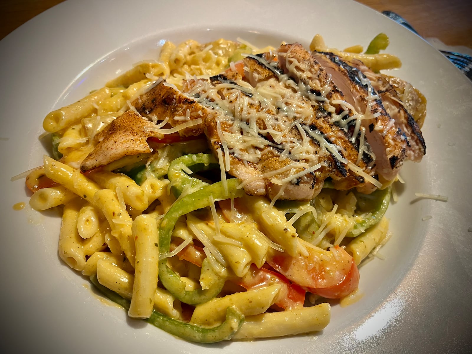 Pictured is the Cajun Chicken Penne with gluten-free noodles. The noodles were tossed in a spicy Cajun cream sauce and topped with a blackened chicken breast, spicy sausage and bell peppers. NATALIE JONES/STAFF