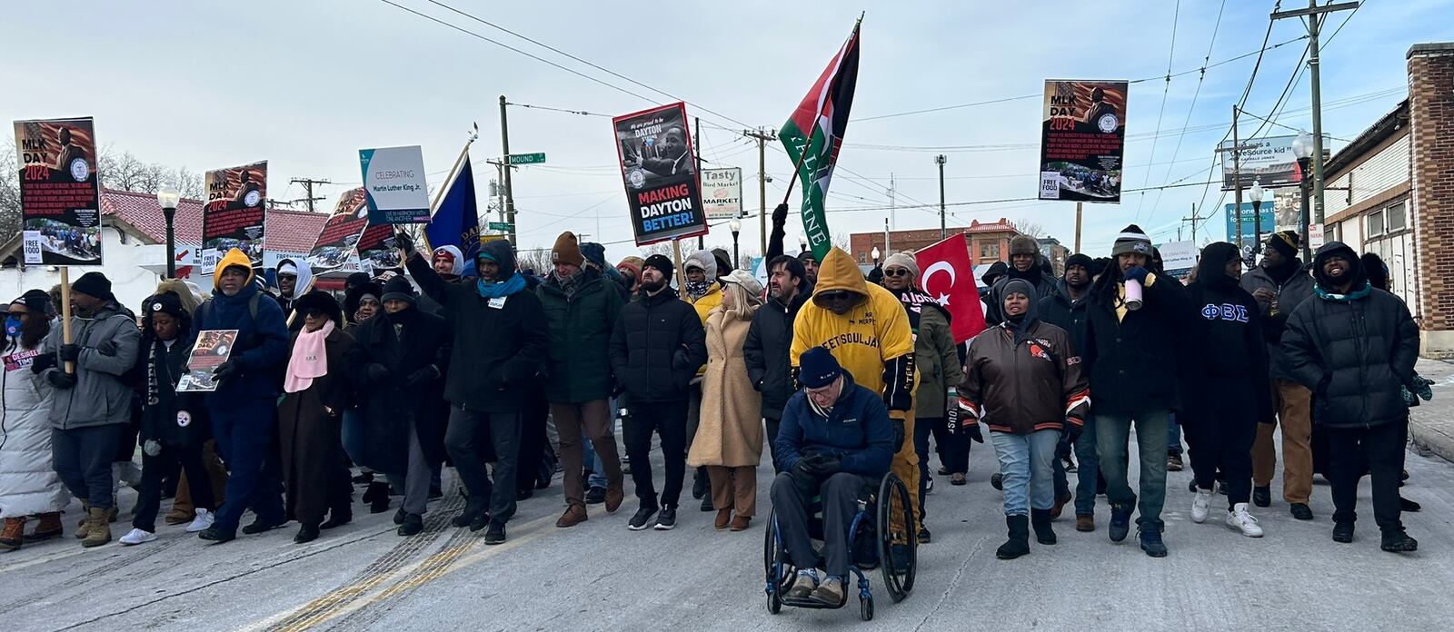 People walk n the MLK Day march on Dayton's West Side Monday in celebration of civil rights leader Martin Luther King, Jr. Eileen McClory / staff