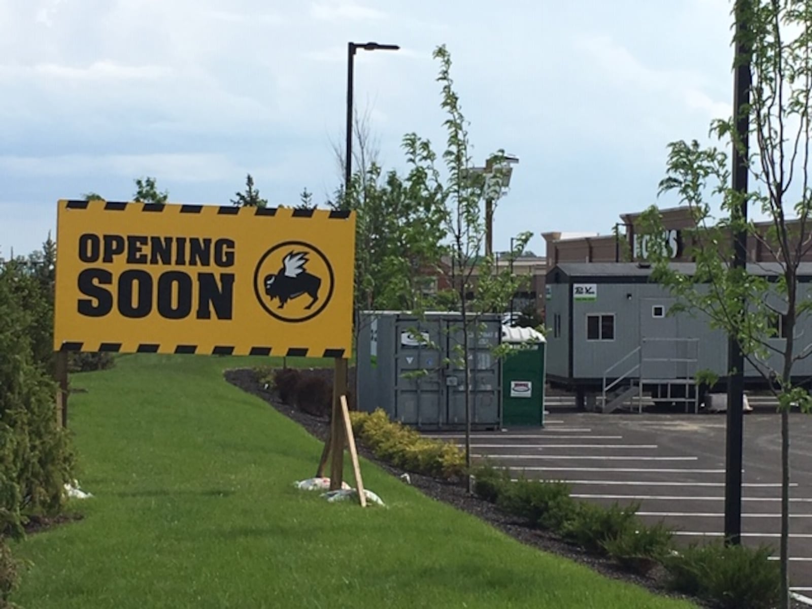 Work has started on the new Buffalo Wild Wings at Austin Landing. The projected opening, which includes the closing of the Springboro restaurant, is scheduled for September, according to company officials. NICK BLIZZARD/STAFF