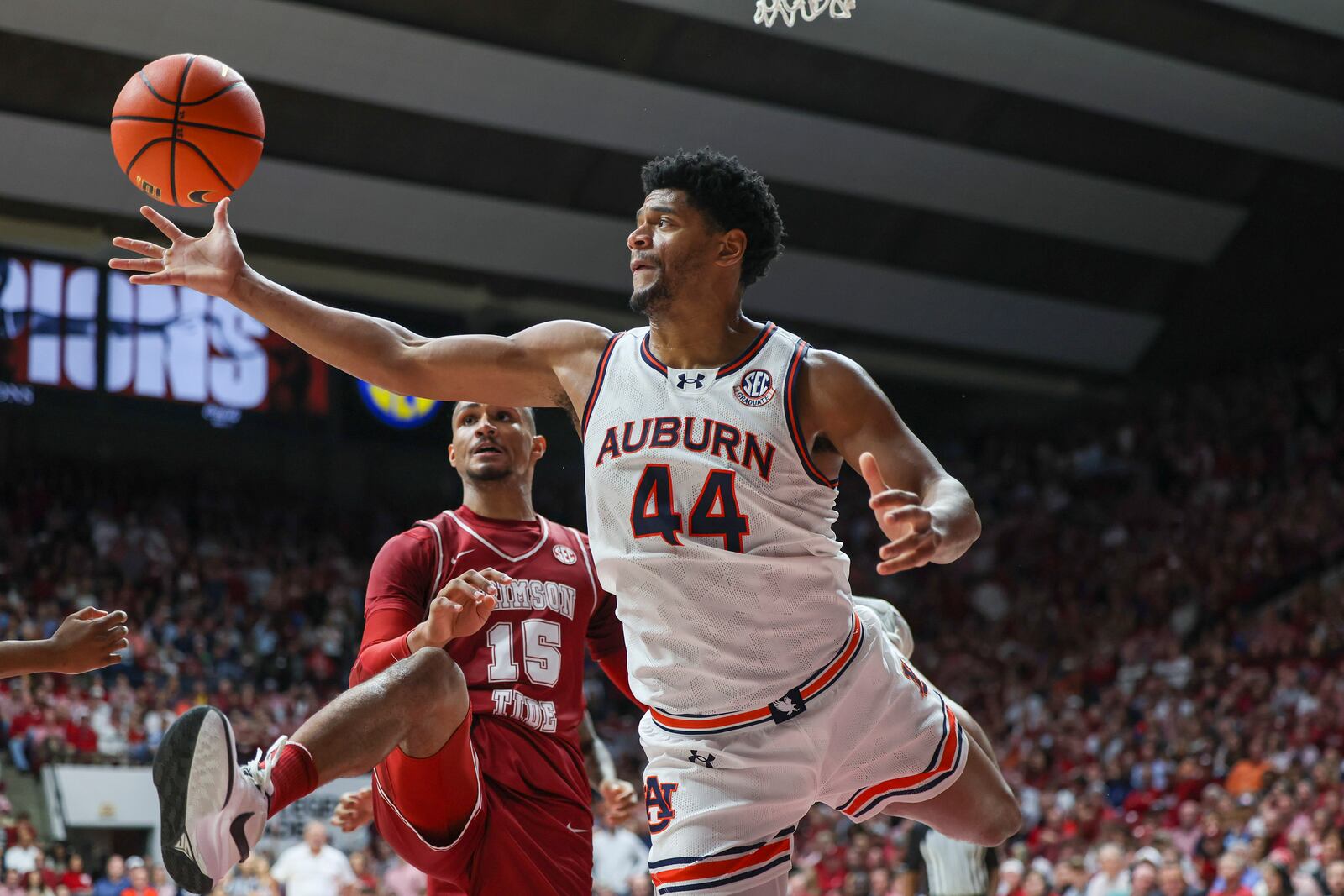 Auburn's Dylan Cardwell (44) rebounds the ball in front of Alabama forward Jarin Stevenson (15) during the first half of an NCAA college basketball game, Saturday, Feb. 15, 2025, in Tuscaloosa, Ala. (AP Photo/Vasha Hunt)