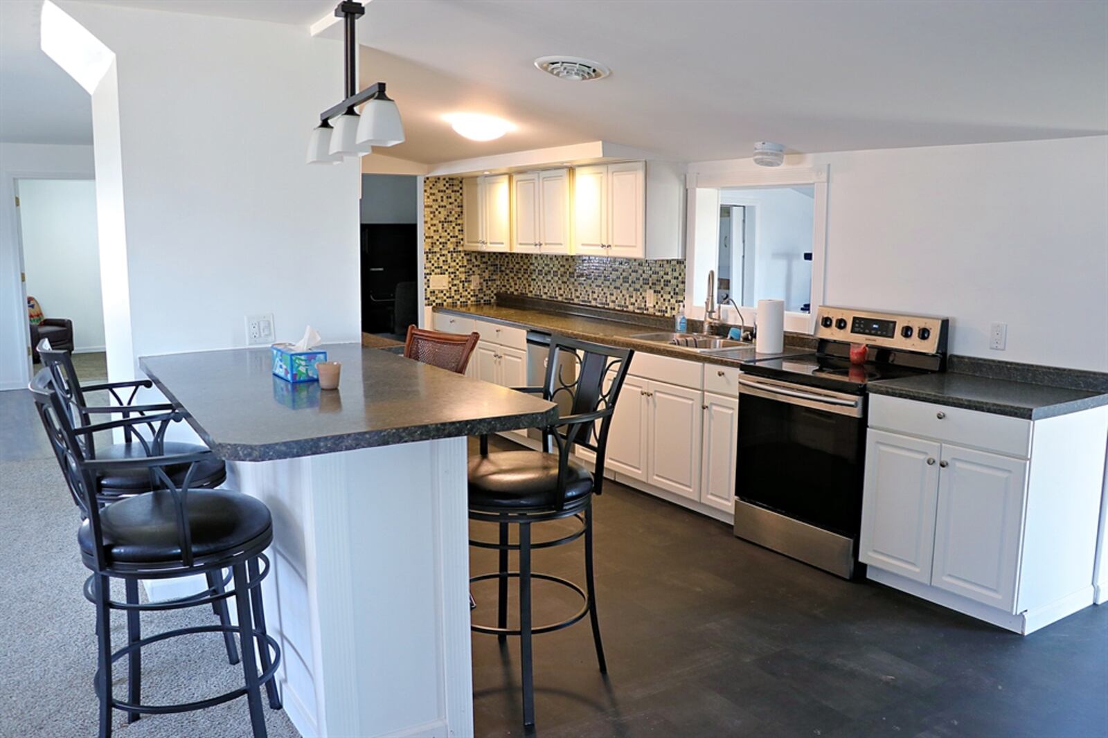 The galley kitchen features plenty of preparation space.