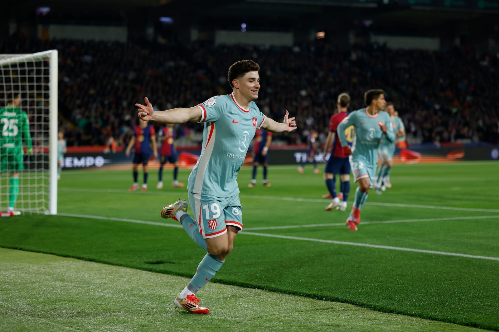 Atletico Madrid's Julian Alvarez celebrates after scoring during a Spanish Copa del Rey, or King's Cup, the semi-final soccer match between Barcelona and Atletico Madrid in Barcelona, Spain, Tuesday, Feb. 25, 2025. AP Photo/Joan Monfort)