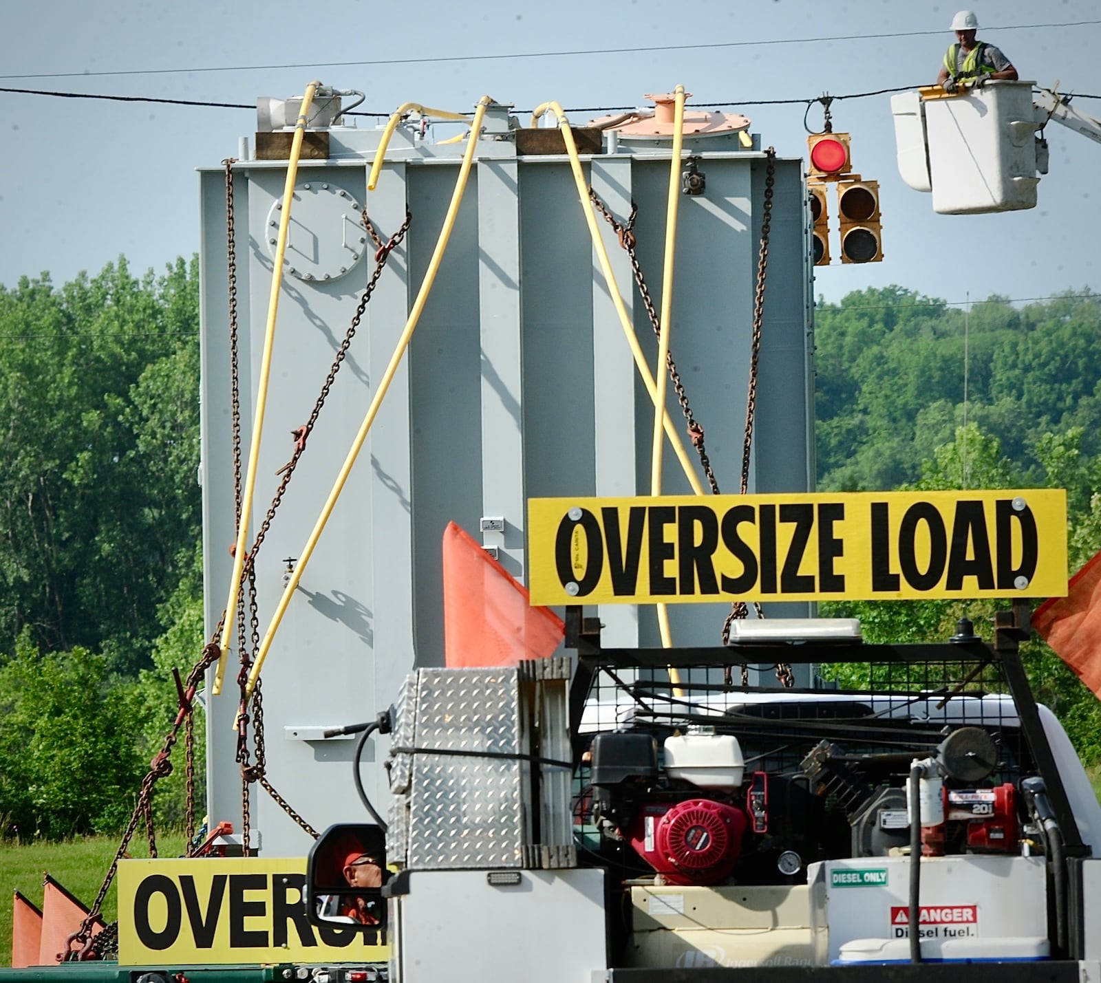 Piqua Steel Inc. moves a superload, an electronic transformer, down Treibein Road Tuesday, June 4, 2024, from the AES substation on Dayton Xenia Road to its new location at the new Honda plant in Fayette County. MARSHALL GORBY\STAFF