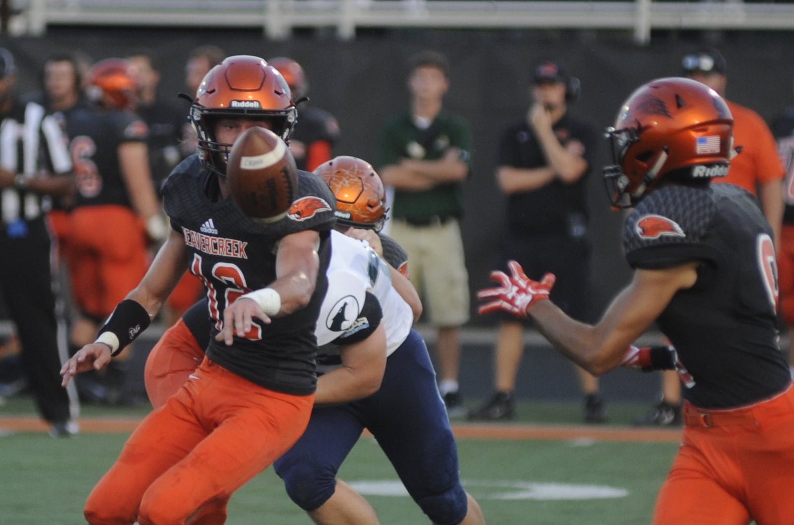 Beavercreek QB Jake Maloney pitches to Drew Nanda. Beavercreek defeated visiting Fairmont 14-3 in a GWOC National East high school football opener on Friday, Sept. 22, 2017. MARC PENDLETON / STAFF