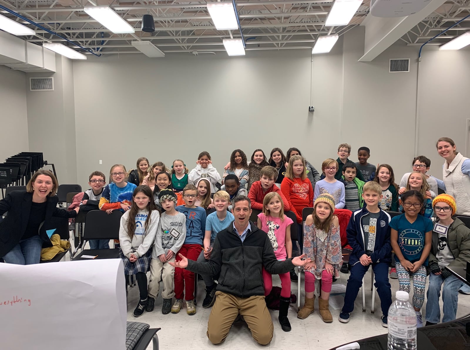 Texas-based composer Mark Burrows with members of Kettering Children’s Choir, which presents the world premiere of his piece, “Green Again,” during its spring concert at Kettering Seventh Day Adventist Church on Wednesday, May 11.