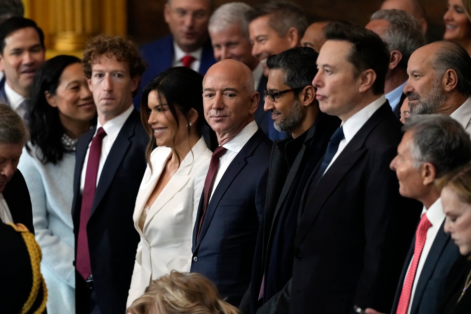 Guests including Mark Zuckerberg, Jeff Bezos, Sundar Pichai and Elon Musk, arrive before the 60th Presidential Inauguration in the Rotunda of the U.S. Capitol in Washington, Monday, Jan. 20, 2025. (AP Photo/Julia Demaree Nikhinson, Pool)