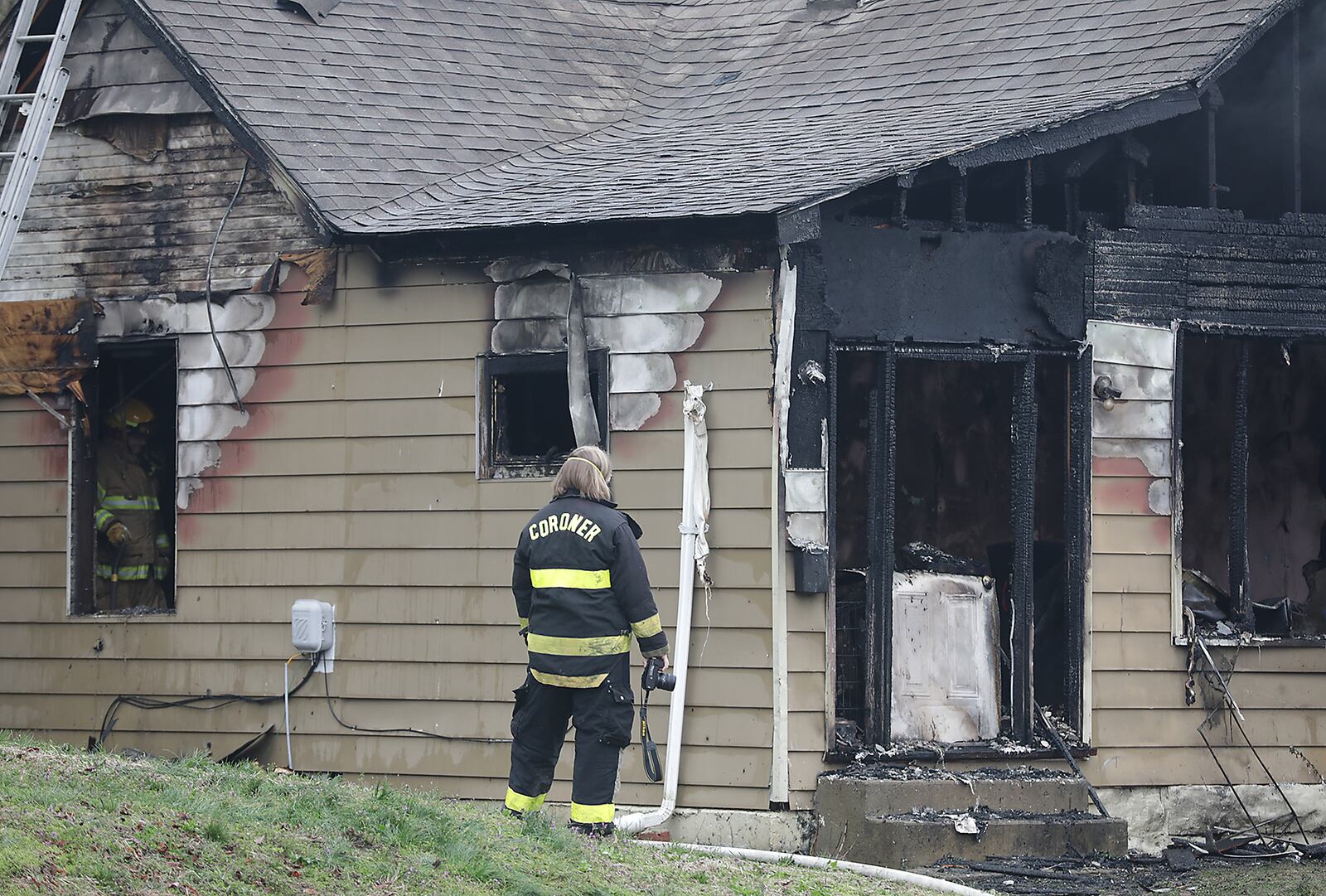 The Clark County Coroner’s Office investigates a fatal fire in the 500 block of Chestnut Street in Springfield Wednesday morning. One person was killed and four people were transported to Springfield Regional with non-life threatening injuries. The fire was called in at 7am by a Clark County Sheriff’s deputy on his way to work. At least one dog was also killed in the blaze. BILL LACKEY/STAFF