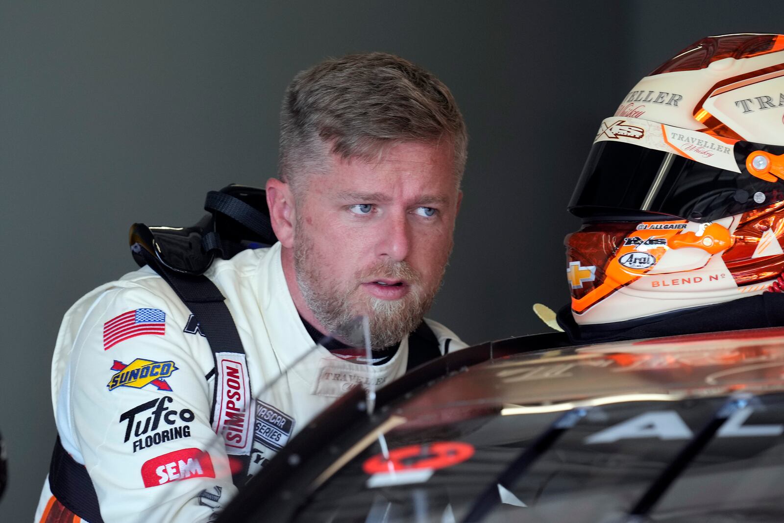 Justin Allgaier gets into his car during a practice for the NASCAR Daytona 500 auto race Wednesday, Feb. 12, 2025, at Daytona International Speedway in Daytona Beach, Fla. (AP Photo/Chris O'Meara)