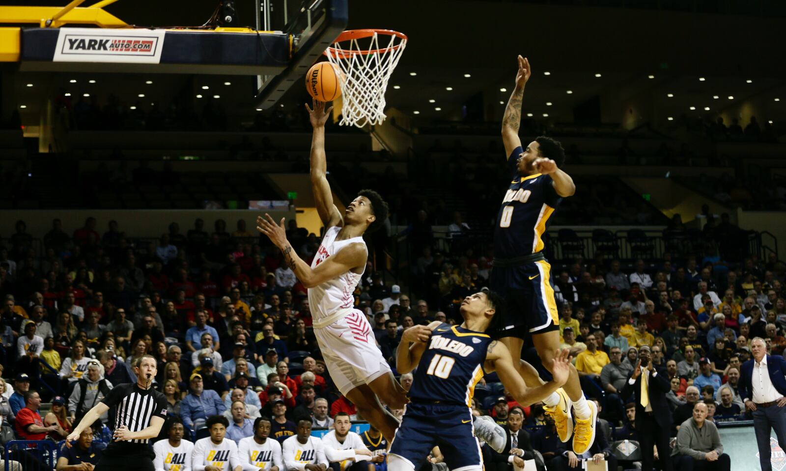 Dayton's Kaleb Washington scores against Toledo in the first round of the NIT on Wednesday, March 16, 2022, at Savage Arena in Toledo. David Jablonski/Staff