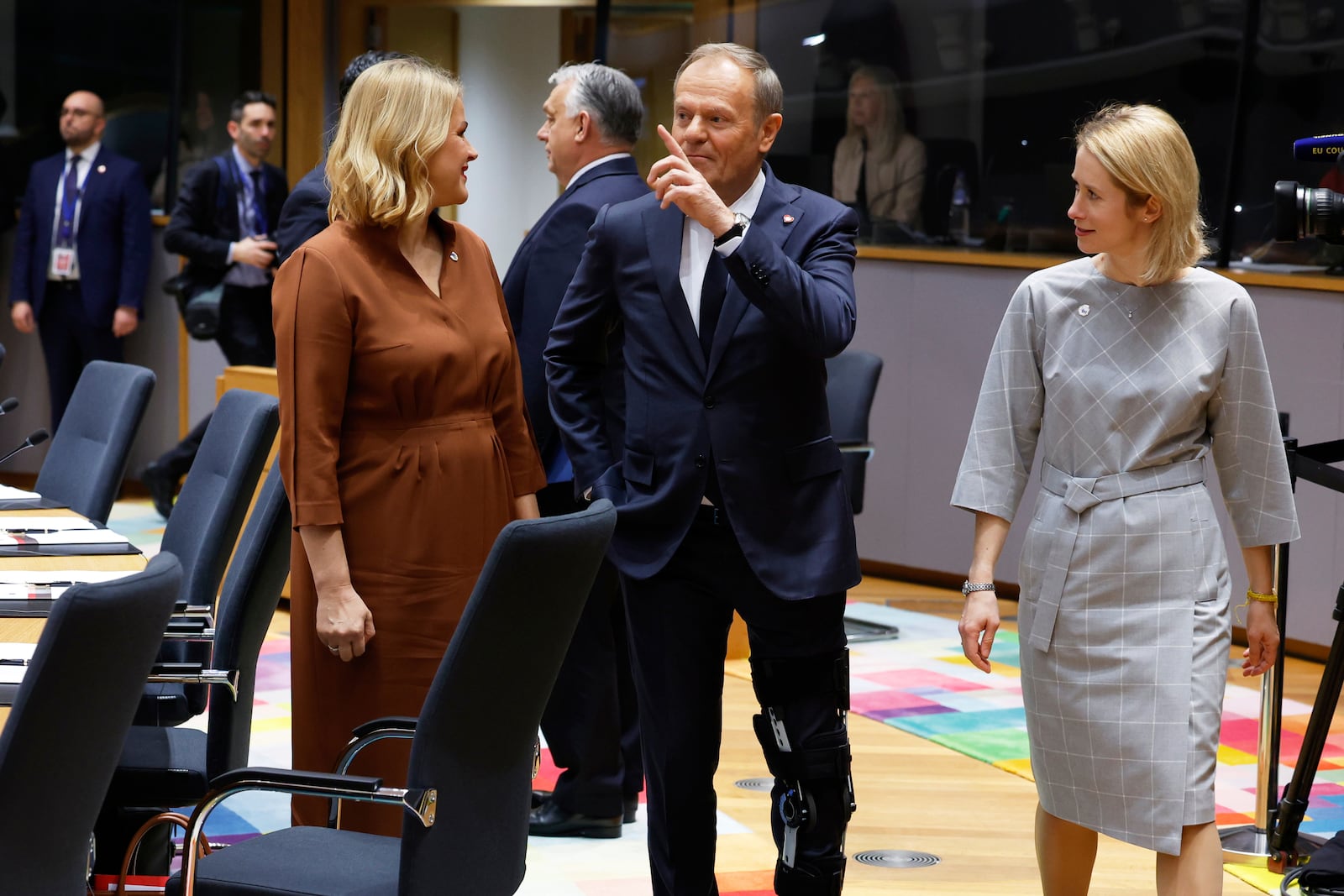 Poland's Prime Minister Donald Tusk, center, speaks with Latvia's Prime Minister Evika Silina, left, and European Union foreign policy chief Kaja Kallas during a round table meeting at an EU Summit in Brussels, Thursday, March 6, 2025. (AP Photo/Geert Vanden Wijngaert)