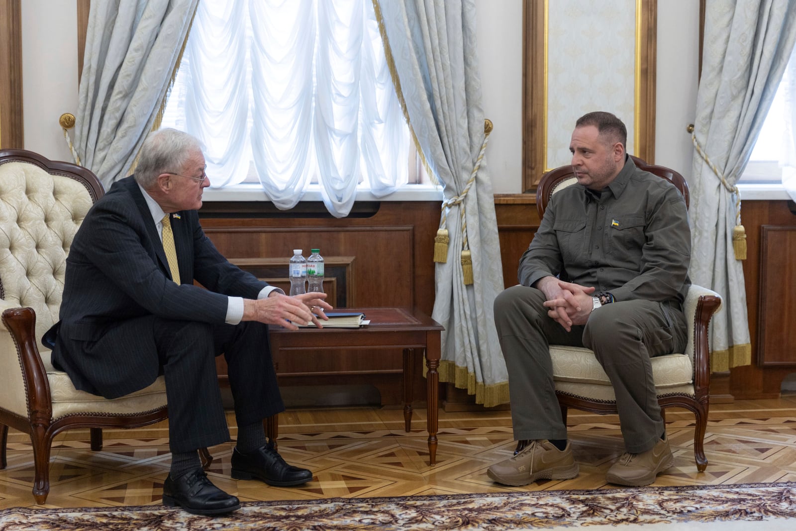 In this photo provided by the Press Service Of The President Of Ukraine on Wednesday Feb. 19, 2025, USA Envoy to Ukraine Keith Kellogg, left, and Head of Ukrainian Presidential Office Andriy Yermak talk during a meeting in Kyiv, Ukraine. (Press Service Of The President Of Ukraine via AP)