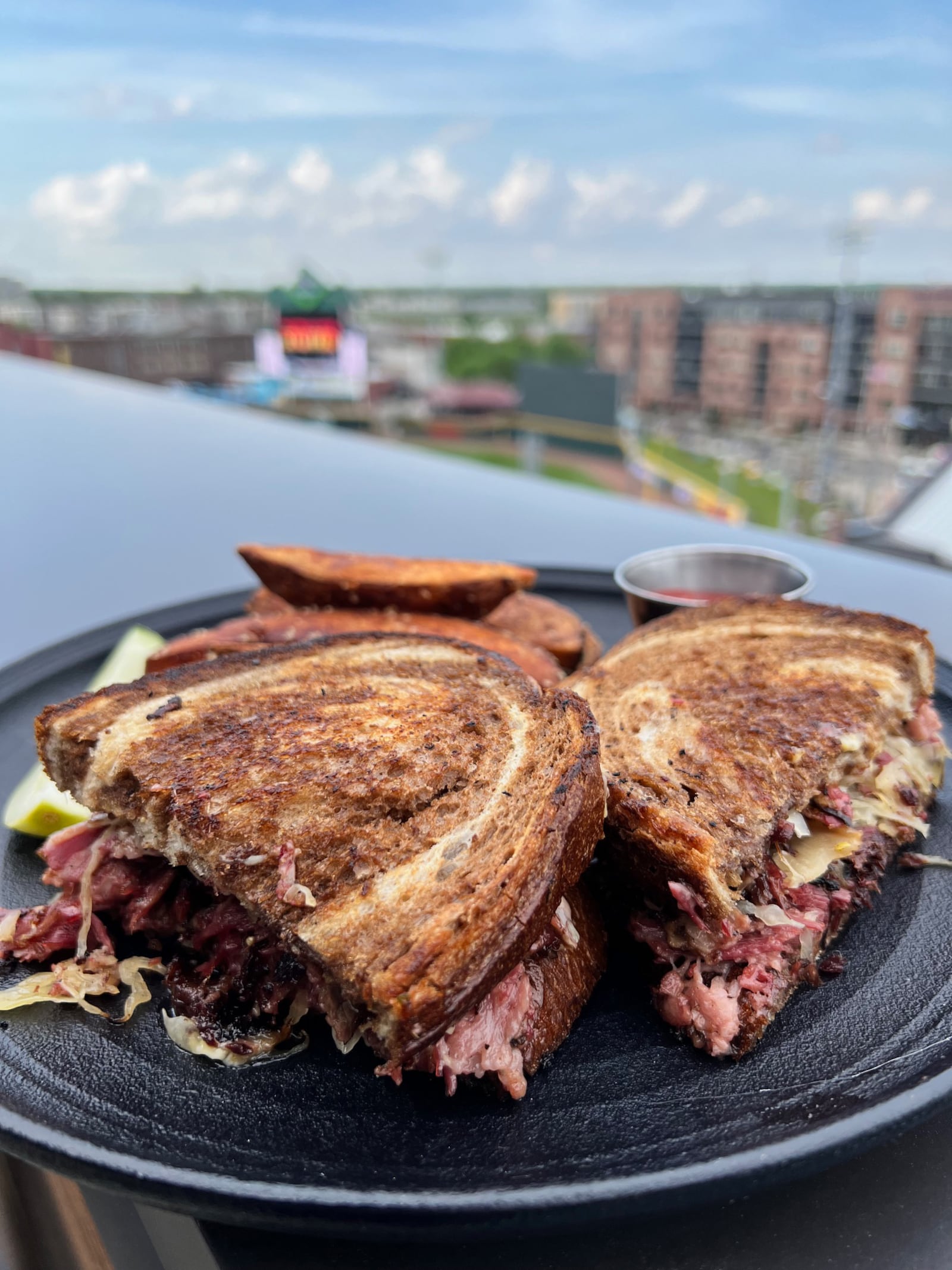 The Reuben at the Foundry rooftop at the AC Hotel can be enjoyed with views of the Dayton Dragons field.