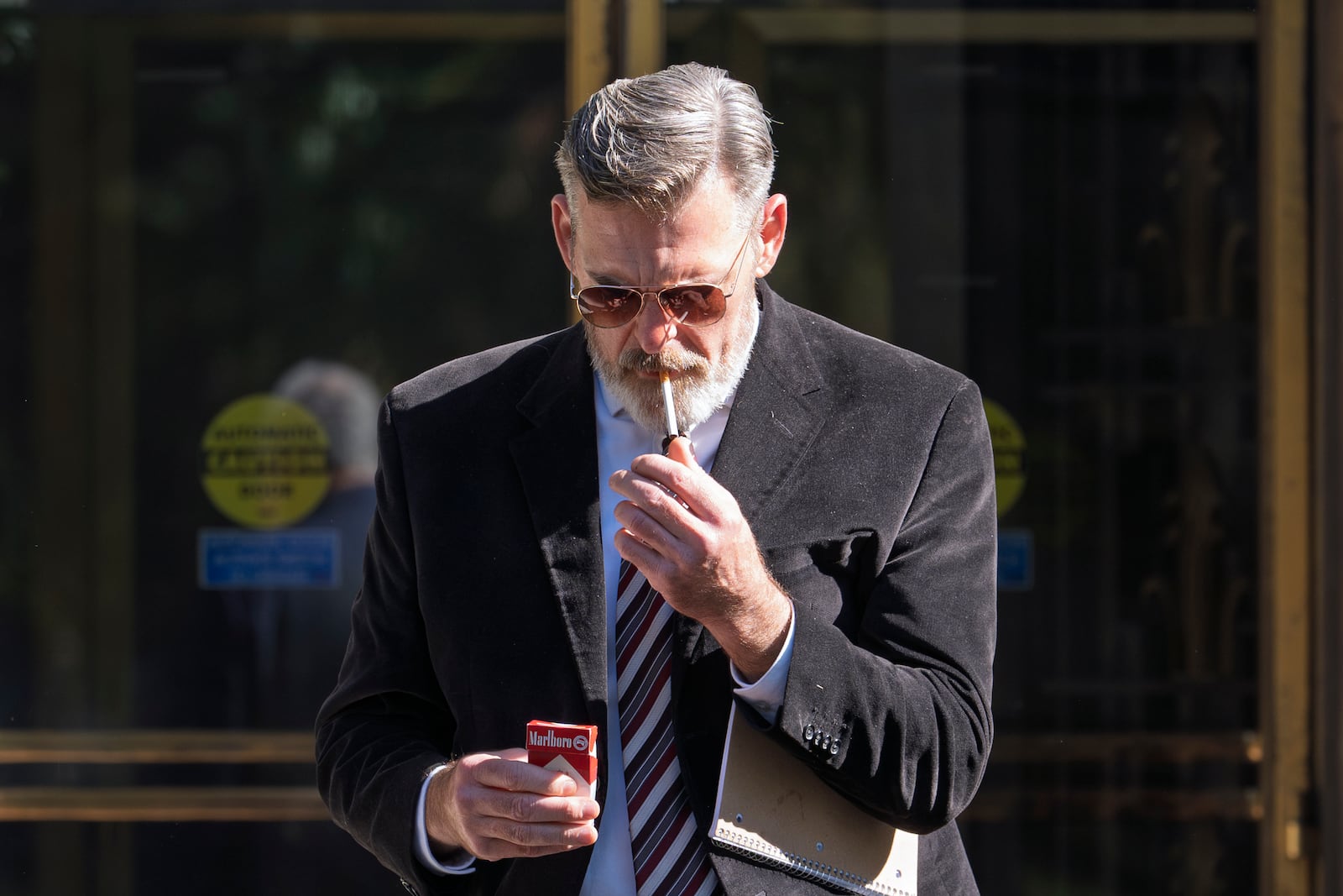 Actor Jay Johnston emerges from the U.S. District Courthouse in Washington, Monday, Oct. 28, 2024, after been sentenced to one year in prison for his part in a mob’s attack on the U.S. Capitol nearly four years ago. Johnston joined other rioters in a “heave ho” push against police officers guarding a tunnel entrance to the Capitol during the Jan. 6, 2021, riot. (AP Photo/J. Scott Applewhite)