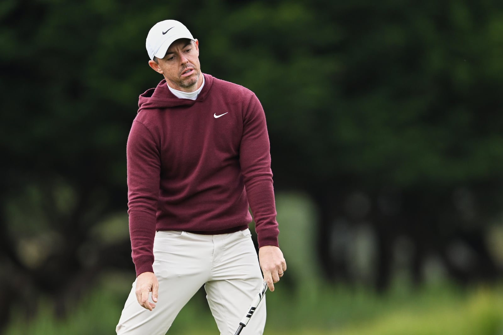 Rory McIlroy of Northern Ireland reacts after missing a putt on the third hole at Pebble Beach Golf Links during the second round of the AT&T Pebble Beach Pro-Am golf tournament, Friday, Jan. 31, 2025, in Pebble Beach, Calif. (AP Photo/Nic Coury)