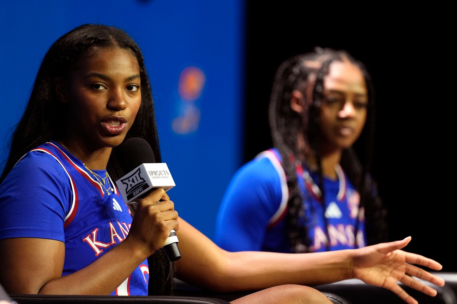 Kansas' S'Mya Nichols addresses the media during the NCAA college Big 12 women's basketball media day, Tuesday, Oct. 22, 2024, in Kansas City, Mo. (AP Photo/Charlie Riedel)