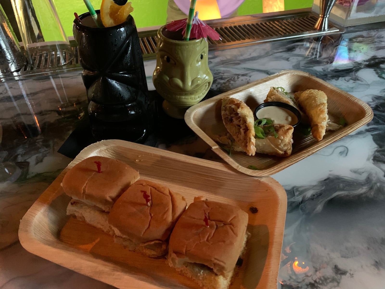 Hawaiian rolls with griddled Spam, caramelized scallion, melted swiss and spicy Chinese mustard (3 for $9.95) and Death Rolls ($9.95) — generously stuffed alligator egg rolls with peppers, onions, cabbage and dirty rice.