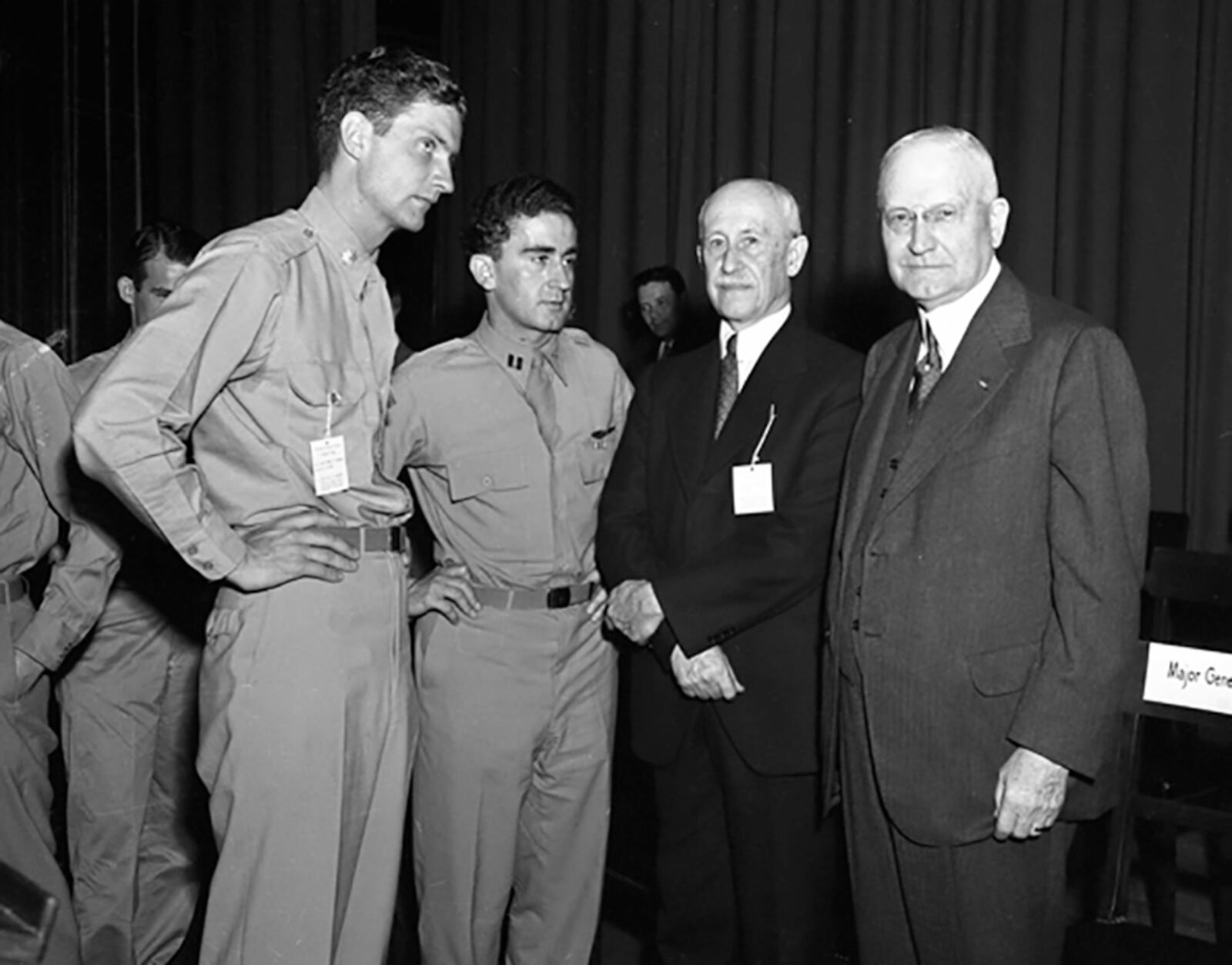 Memphis Belle pilot, Major Robert Morgan and co-pilot Cpt. James Verinis pose with Orville Wright and Col. Edward A. Deeds in the NCR Auditorium in Dayton.  NCR ARCHIVE AT CARILLON HISTORICAL PARK