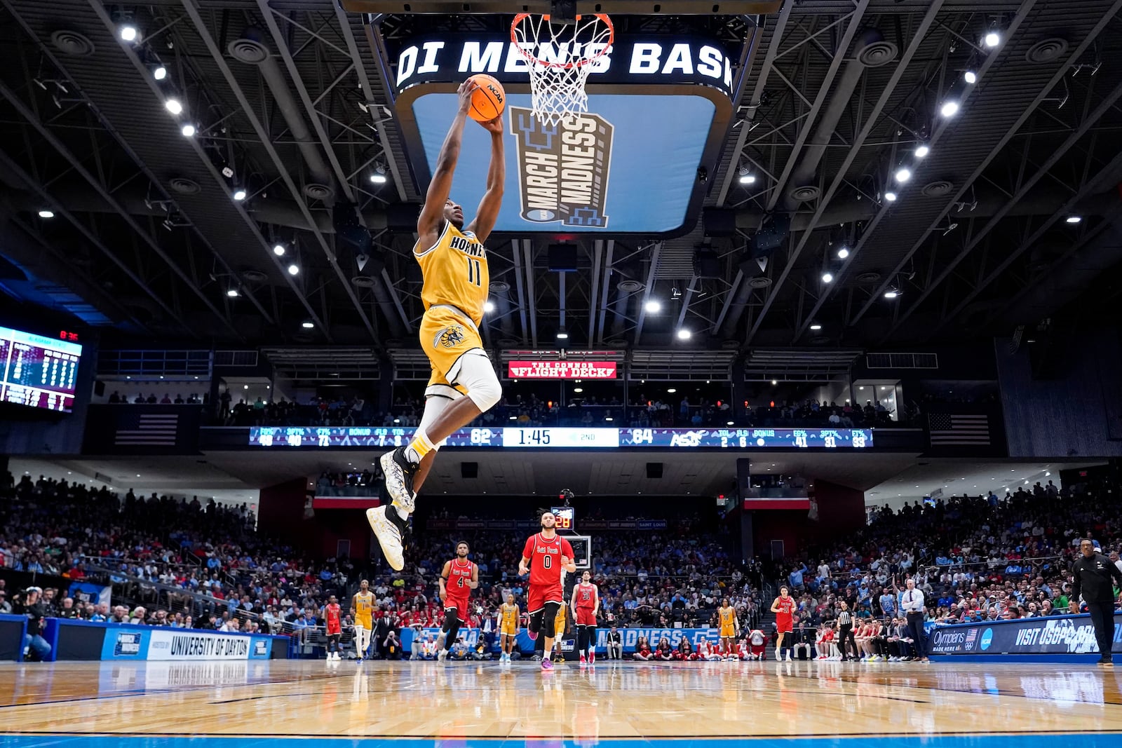 Alabama State guard Micah Octave (11) dunks during the second half of a First Four college basketball game against Saint Francis in the NCAA Tournament, Tuesday, March 18, 2025, in Dayton, Ohio. (AP Photo/Jeff Dean)