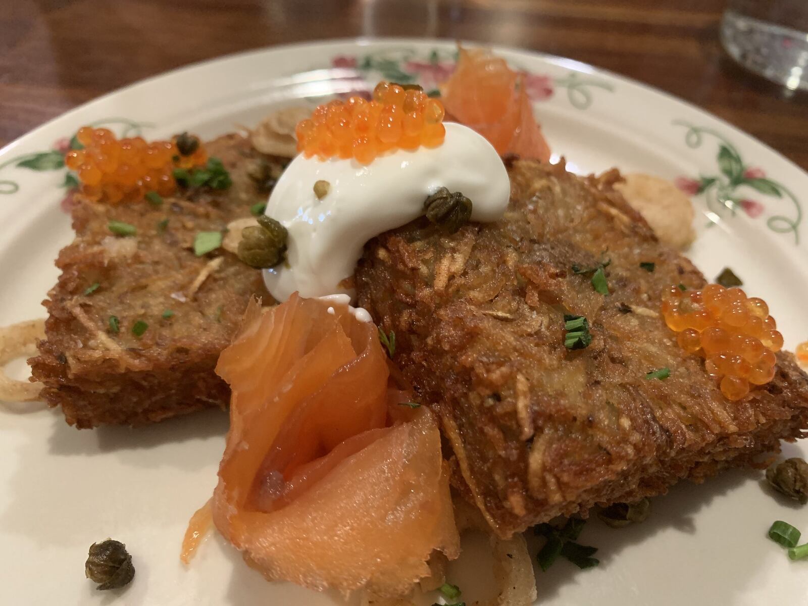 Ambrose and Eve loaded hash brown ($13) dressed up with smoked salmon, fried pickled onion, capers, creme fraiche and caviar. CONTRIBUTED PHOTO BY ALEXIS LARSEN