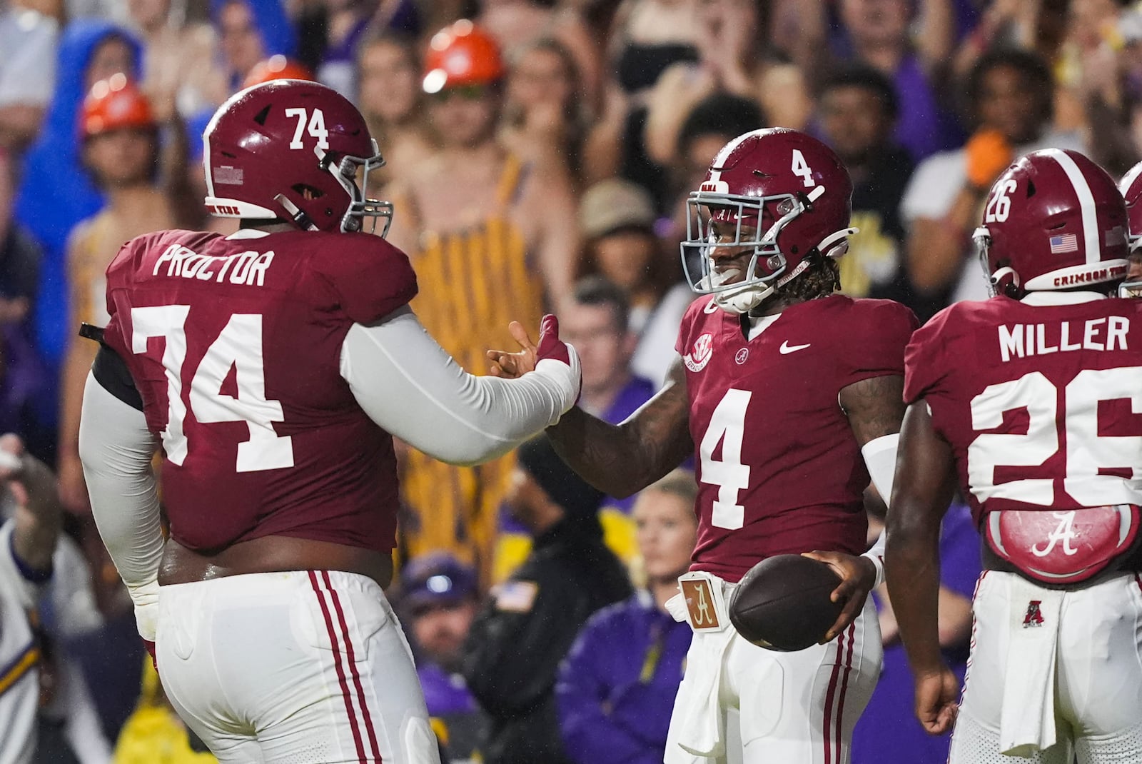 Alabama quarterback Jalen Milroe (4) celebrates his touchdown carry with Alabama offensive lineman Kadyn Proctor (74) in the first half an NCAA college football game against LSU in Baton Rouge, La., Saturday, Nov. 9, 2024. (AP Photo/Gerald Herbert)