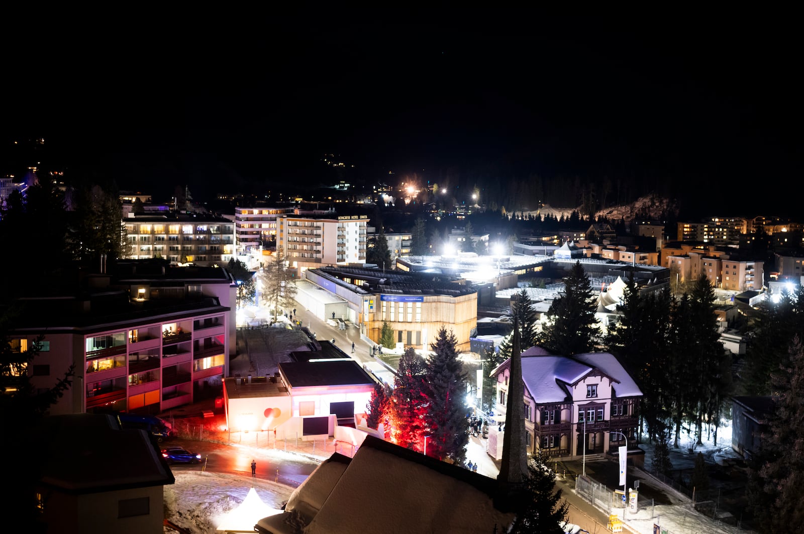 The Congress Center where the Annual Meeting of the World Economy forum take place is illuminated on the eve of the meeting in Davos, Switzerland, Sunday, Jan. 19, 2025. (AP Photo/Markus Schreiber)