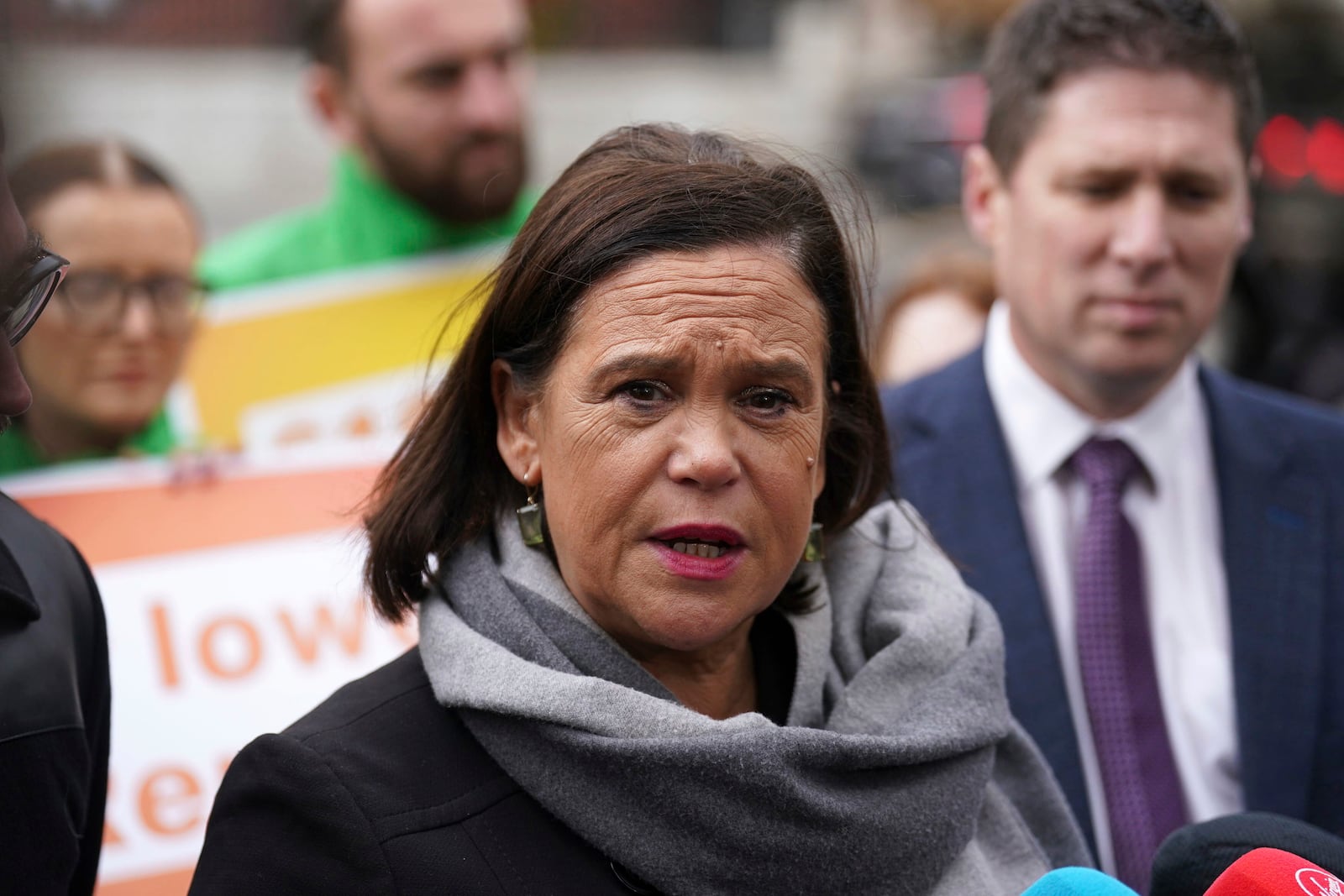 Sinn Fein leader Mary Lou McDonald, center, speaks to the media outside Government Buildings, on the last day of campaigning on the eve of the General Election, in Dublin, Thursday, Nov. 28, 2024. (Brian Lawless/PA via AP)