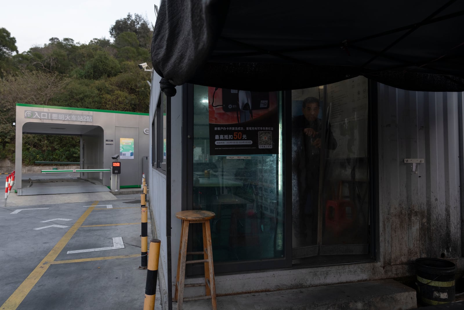 A taxi driver visits a rest stop near a first generation battery swap station by China-based CATL battery manufacturing company, in Xiamen, Fujian province, China, Wednesday, Dec. 18, 2024. (AP Photo/Ng Han Guan)