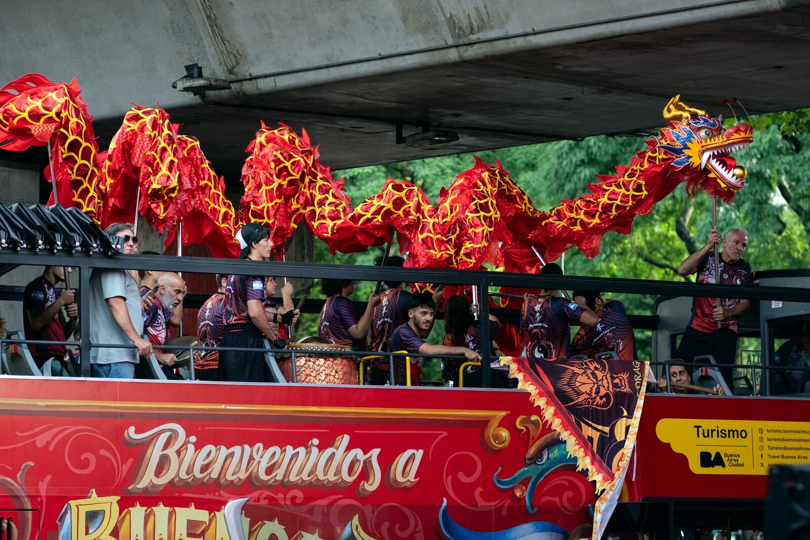 People hold a Dragon puppet during the Chinese New Year celebrations, marking the year of the snake, in Buenos Aires, Argentina, Saturday, Jan. 25, 2025. (AP Photo/Rodrigo Abd)