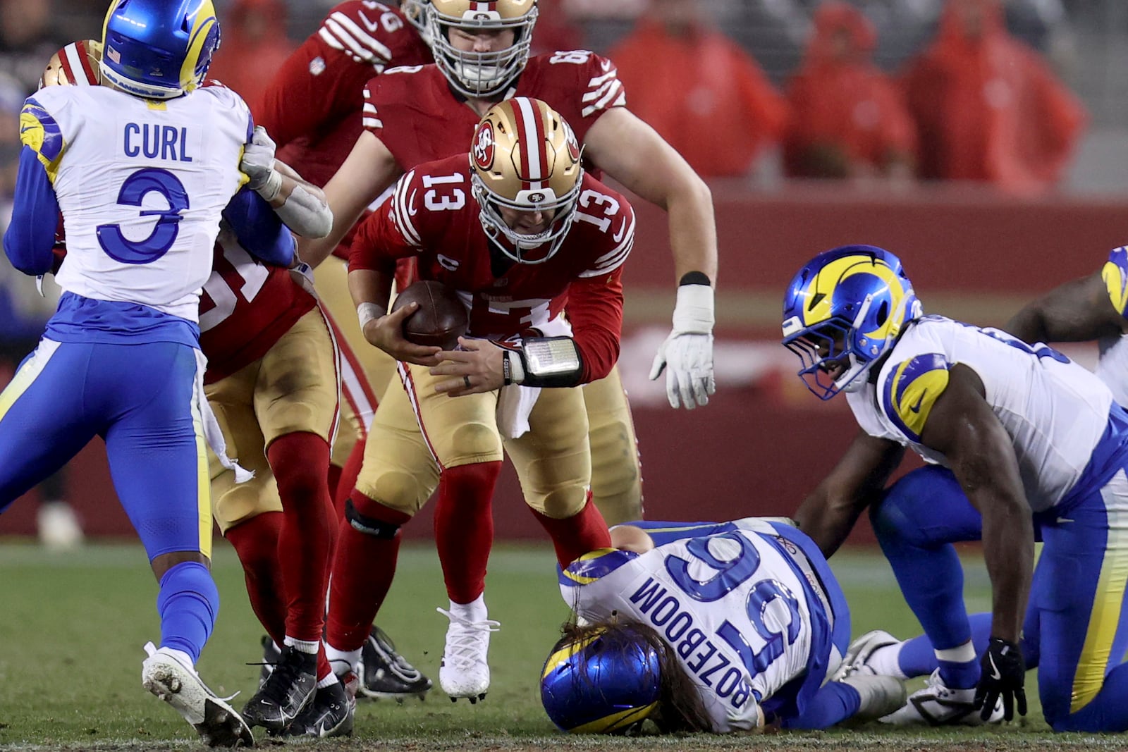 FILE - Los Angeles Rams linebacker Christian Rozeboom (56) sacks San Francisco 49ers quarterback Brock Purdy (13) in the fourth quarter of an NFL football game, Thursday, Dec. 12, 2024, in Santa Clara, Calif. (AP Photo/Scot Tucker, File)