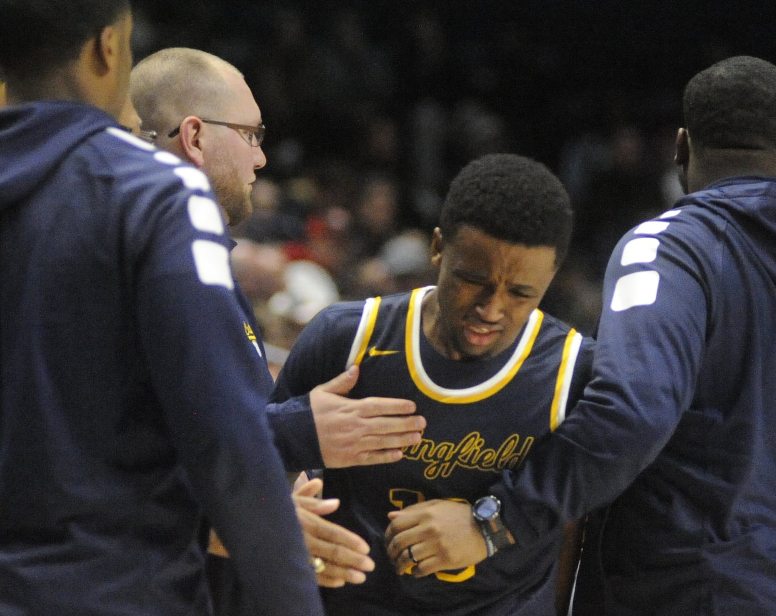 Springfield senior Michael Wallace takes a hard loss. Moeller defeated Springfield 65-44 in a boys high school basketball D-I regional semifinal at Xavier University’s Cintas Center in Cincinnati on Wednesday, March 14, 2018. MARC PENDLETON / STAFF