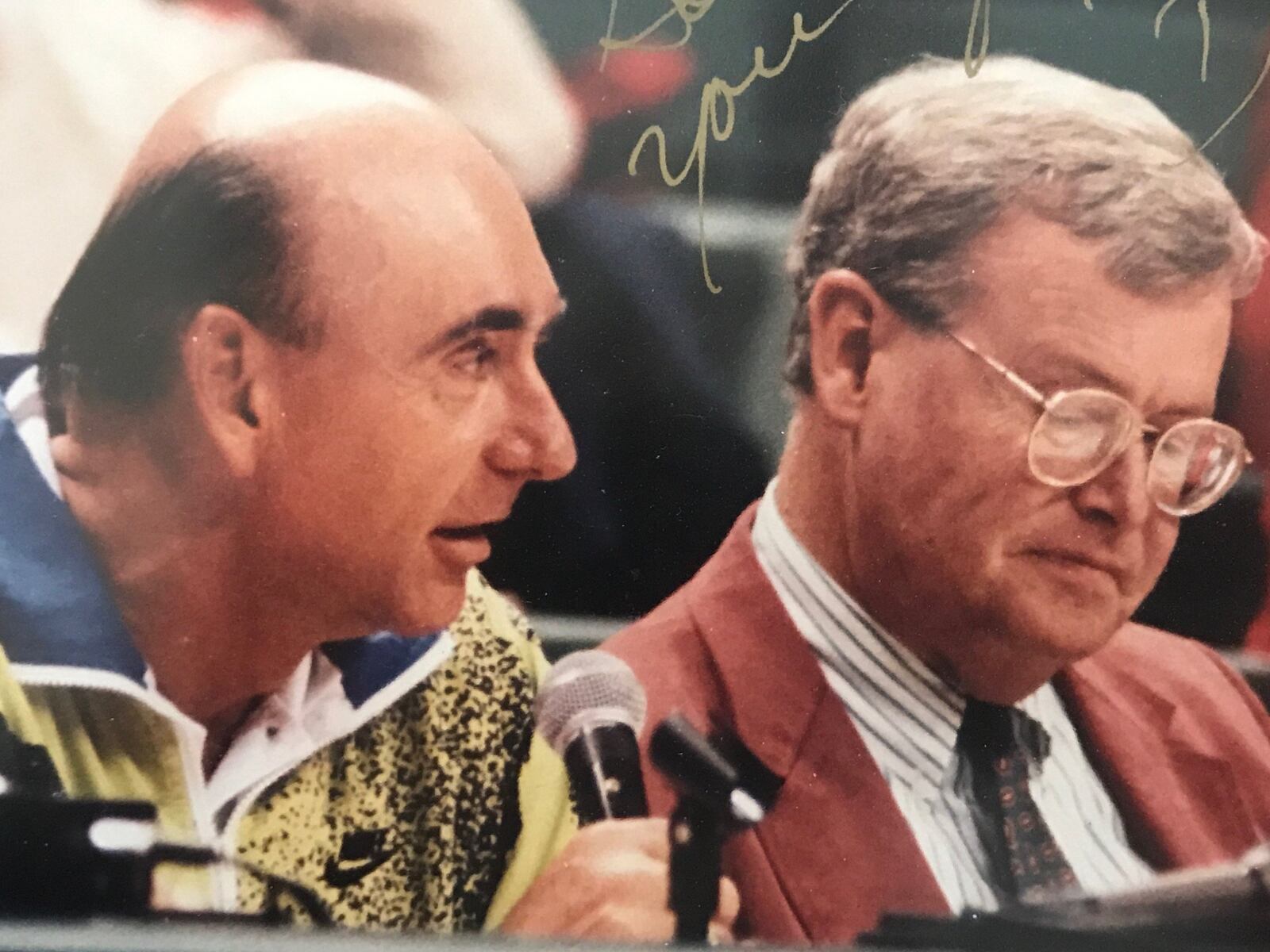 Gordie Wise (right) and Dick Vitale share scorer’s table at Wright State game during a tournament in San Juan, Puerto Rico, several years ago. CONTRIBUTED