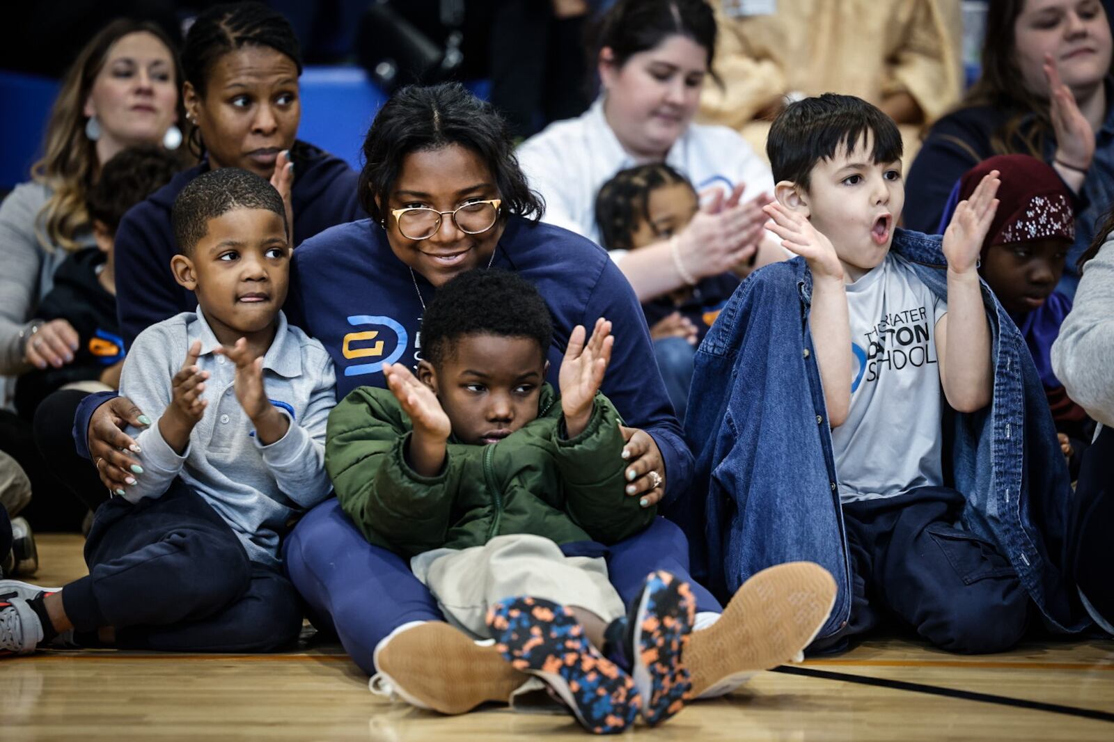 Students at the Greater Dayton School clap after Larry Conner spoke at the school's grand opening. The school was funded by The Connor Group Kids & Community Partners. JIM NOELKER/STAFF