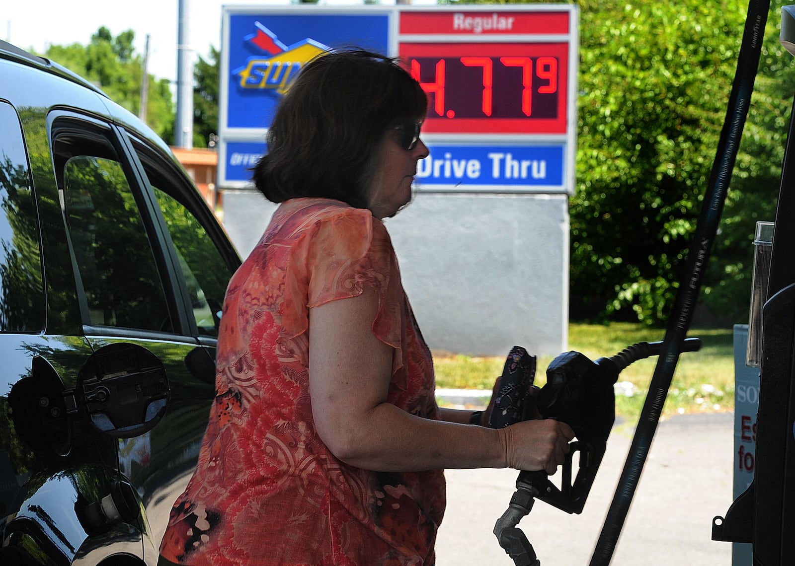 Jamie Havney, gets gas below the national average Monday, June 27, 2022 at the Sunoco station on Kauffman Ave. in Fairborn. MARSHALL GORBY\STAFF