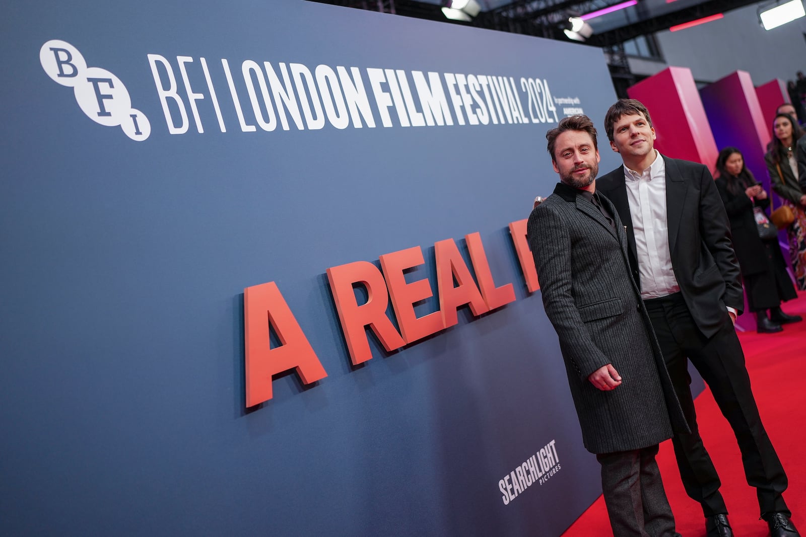 Kieran Culkin, left, and director Jesse Eisenberg pose for photographers upon arrival at the premiere of the film 'A Real Pain' during the London Film Festival on Sunday, Oct. 13, 2024, in London. (Photo by Scott A Garfitt/Invision/AP)