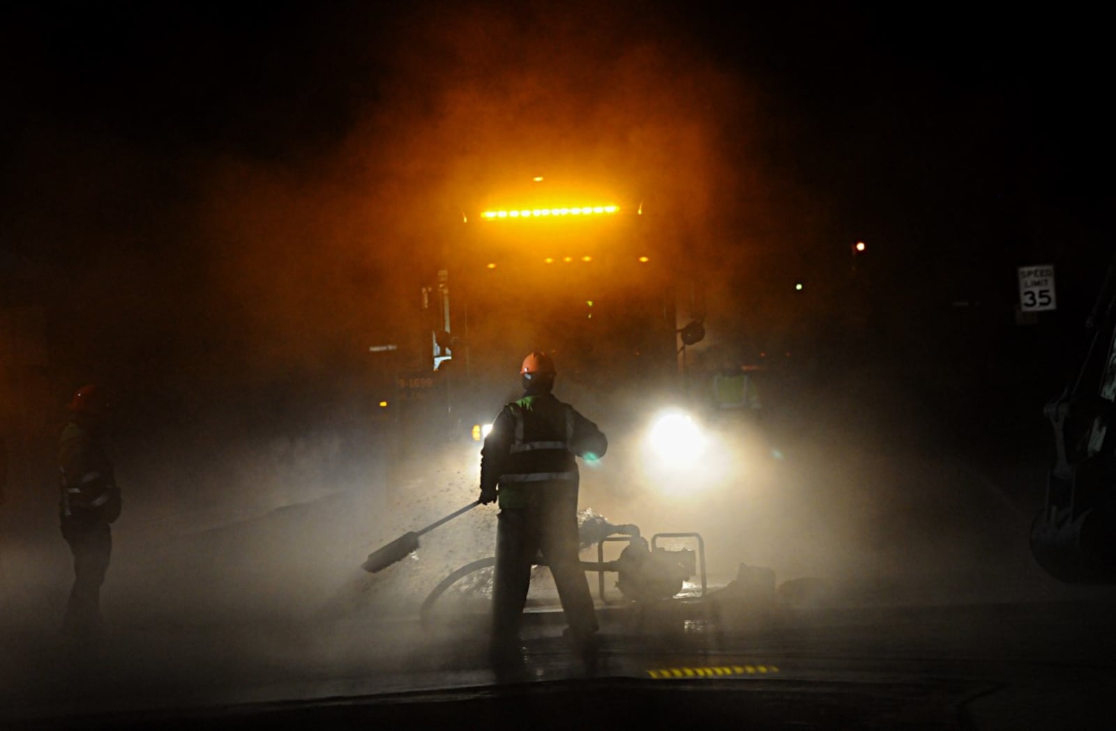 Crews work to make repairs to a water main break on Beaver Valley Road in Beavercreek Friday morning. MARSHALL GORBY/STAFF