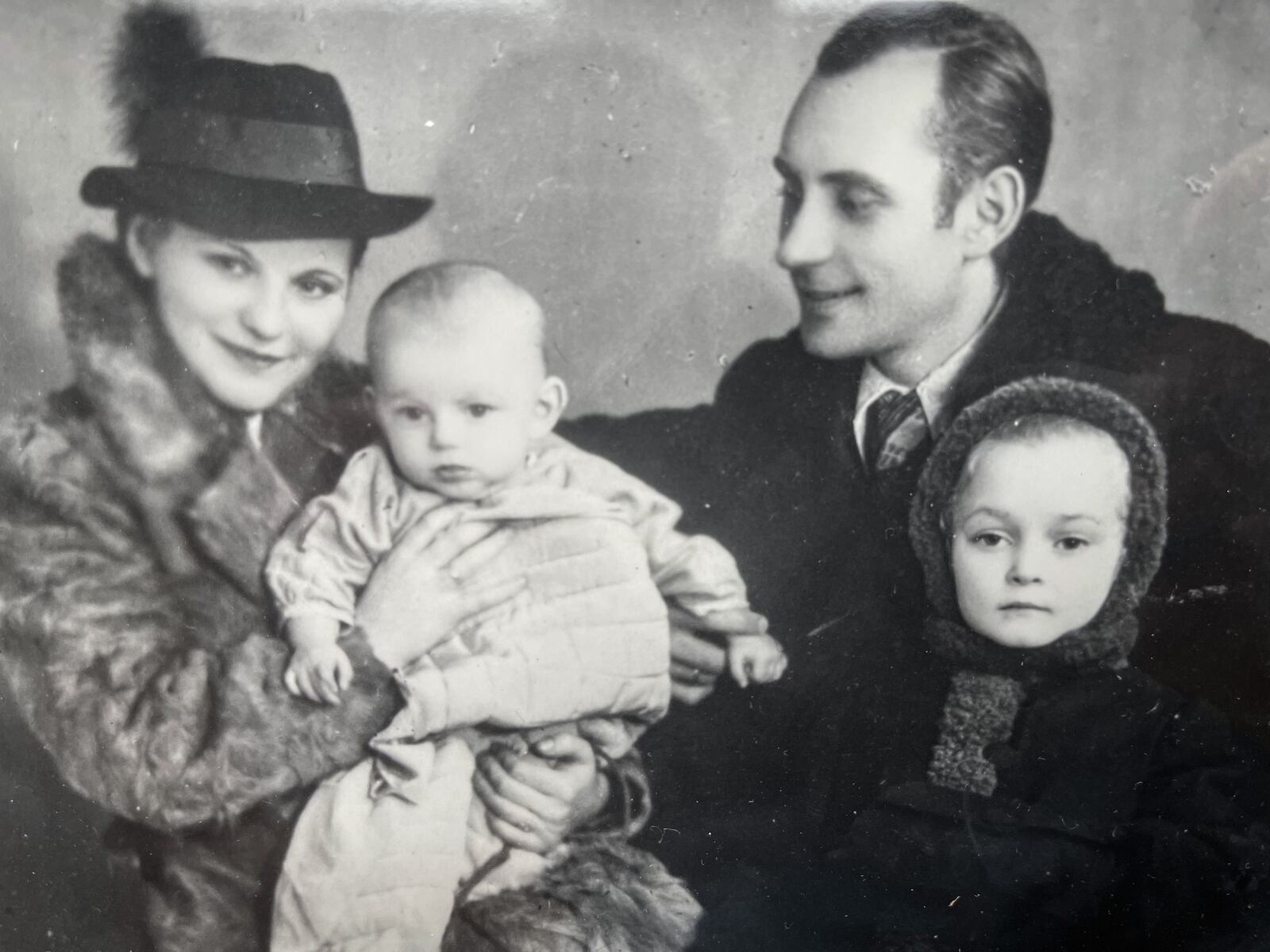 A photo of Don Urbansky, held by his mother, Julia, along with his father, Omelan and his sister, Lesia, in the 1940s. JIM NOELKER/STAFF